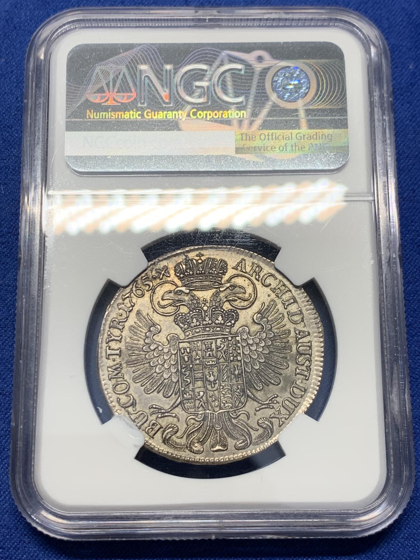《竞宝斋》第343场 周日，周一，2场连拍 （全场包邮） NGC AU55 奥地利1765神罗维也纳厂玛利亚特蕾莎1/2泰勒，经典原铸大奶妈，半泰勒好品稀有，11月同版62分含佣金合人民币5700+成交。此枚黑包浆，细节优秀，适宜自藏