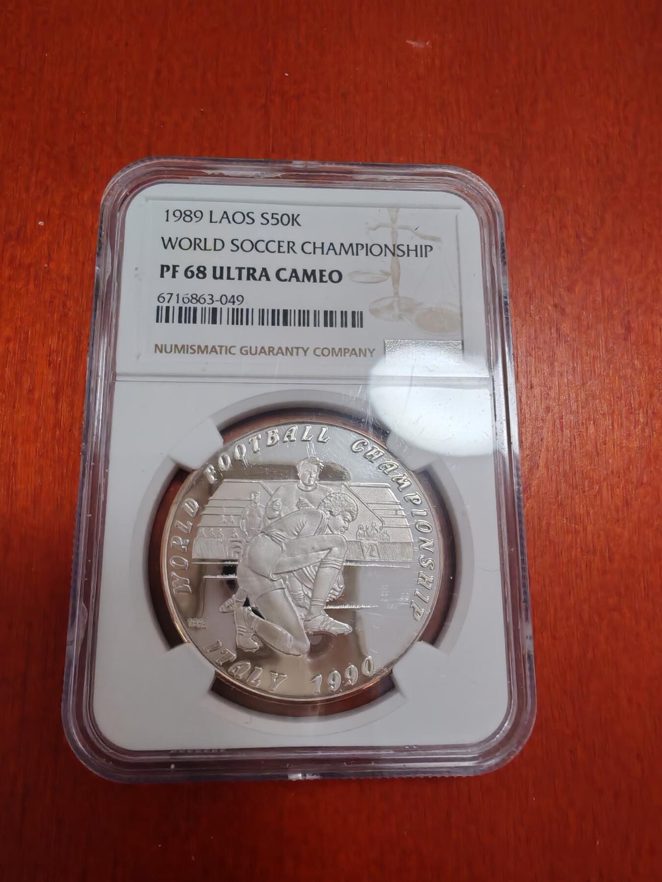 长老汇龙年精选第四十二场拍卖 1989老挝世界杯50基普精制银币，NGC PF68UC