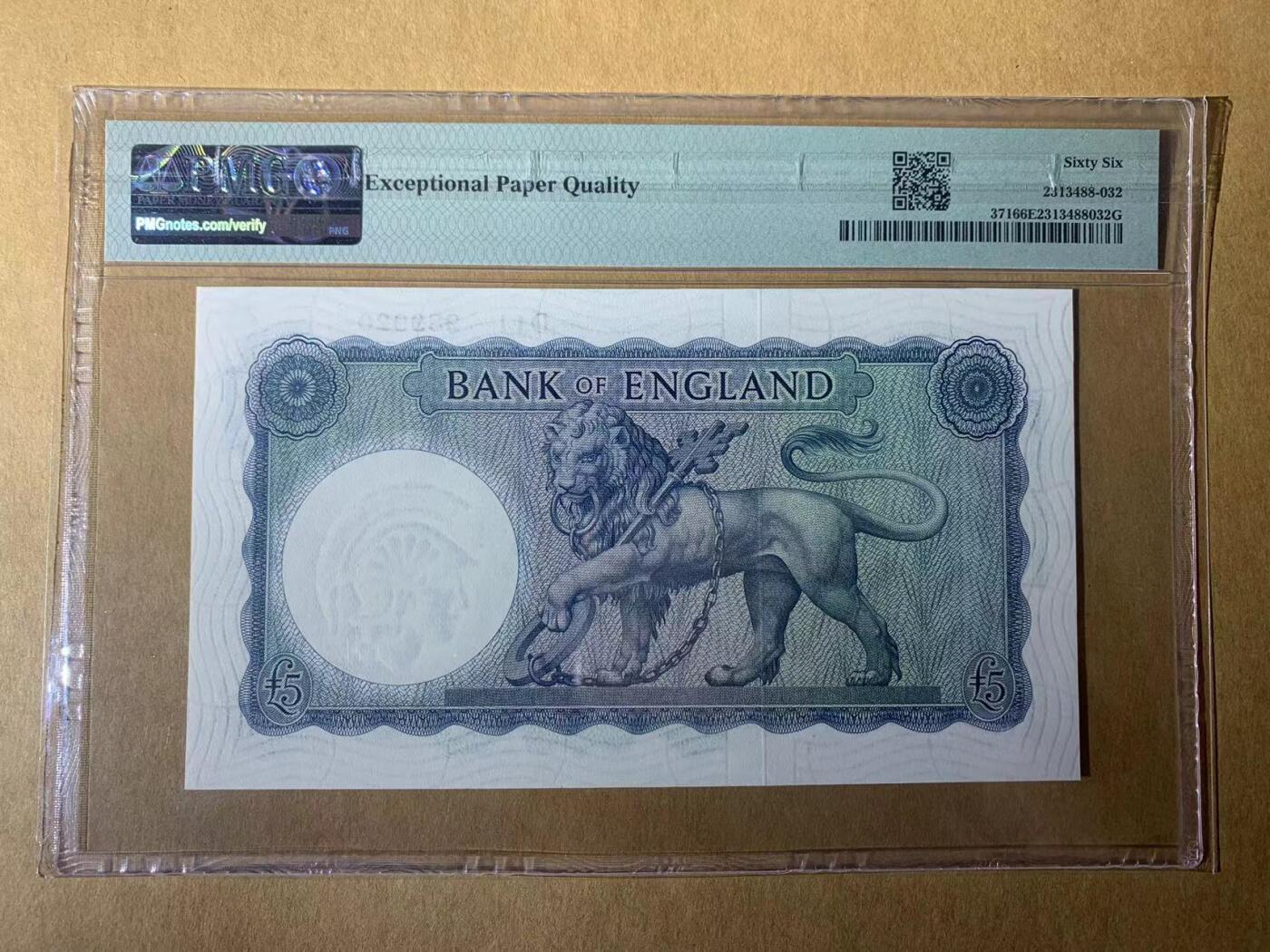 【礼羽收藏】🌏世界钱币拍卖第131期 【D11 289920】1957年英国B序列5镑纸币 早期初版 蓝色实心版 无3457朦胧号 PMG66  圣乔治屠龙