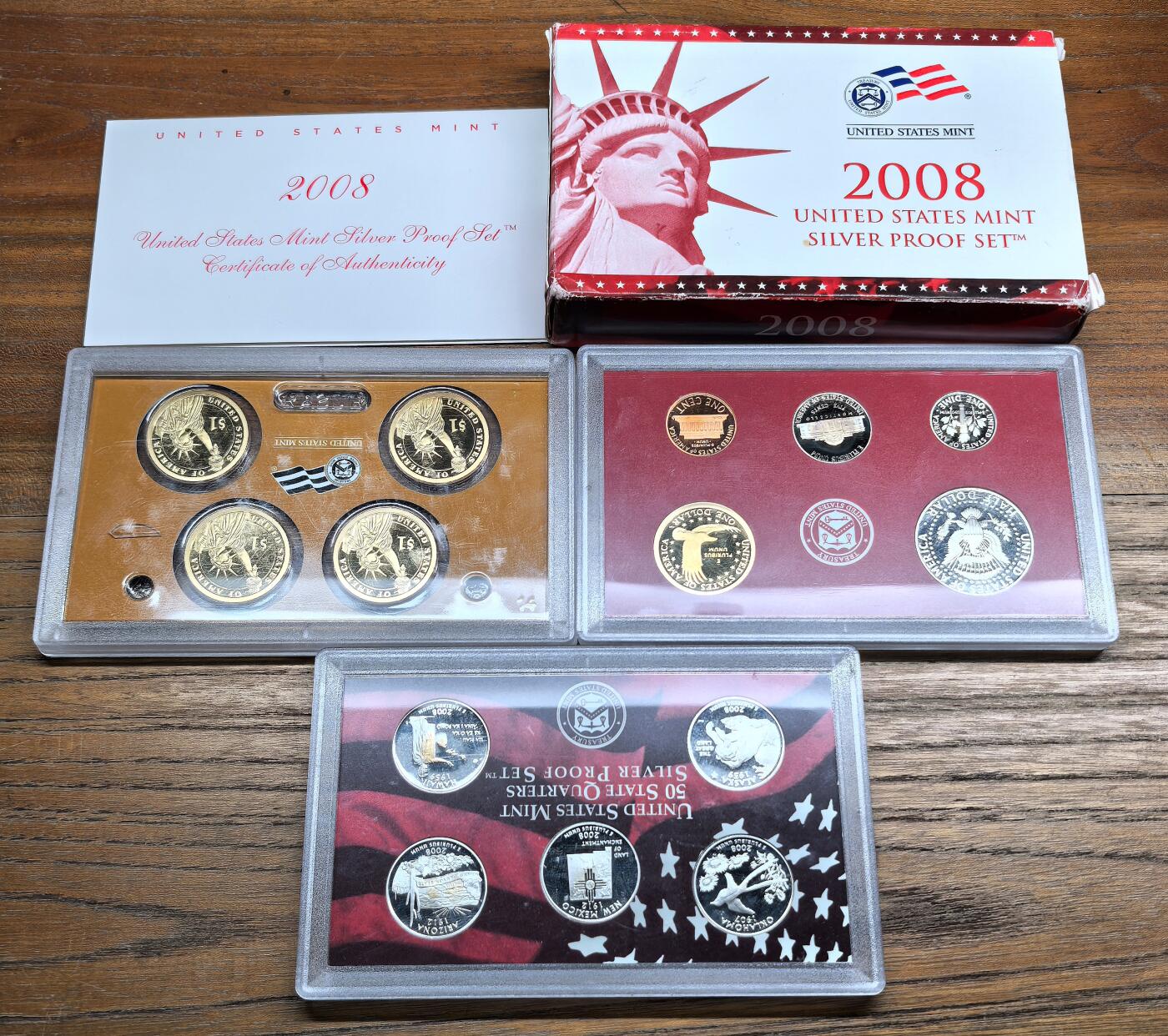 凡希社世界钱币微拍第二百九十五期 2008美国PROOF SET，含两套银币一套铜币，铜币塑盒边沿有裂。