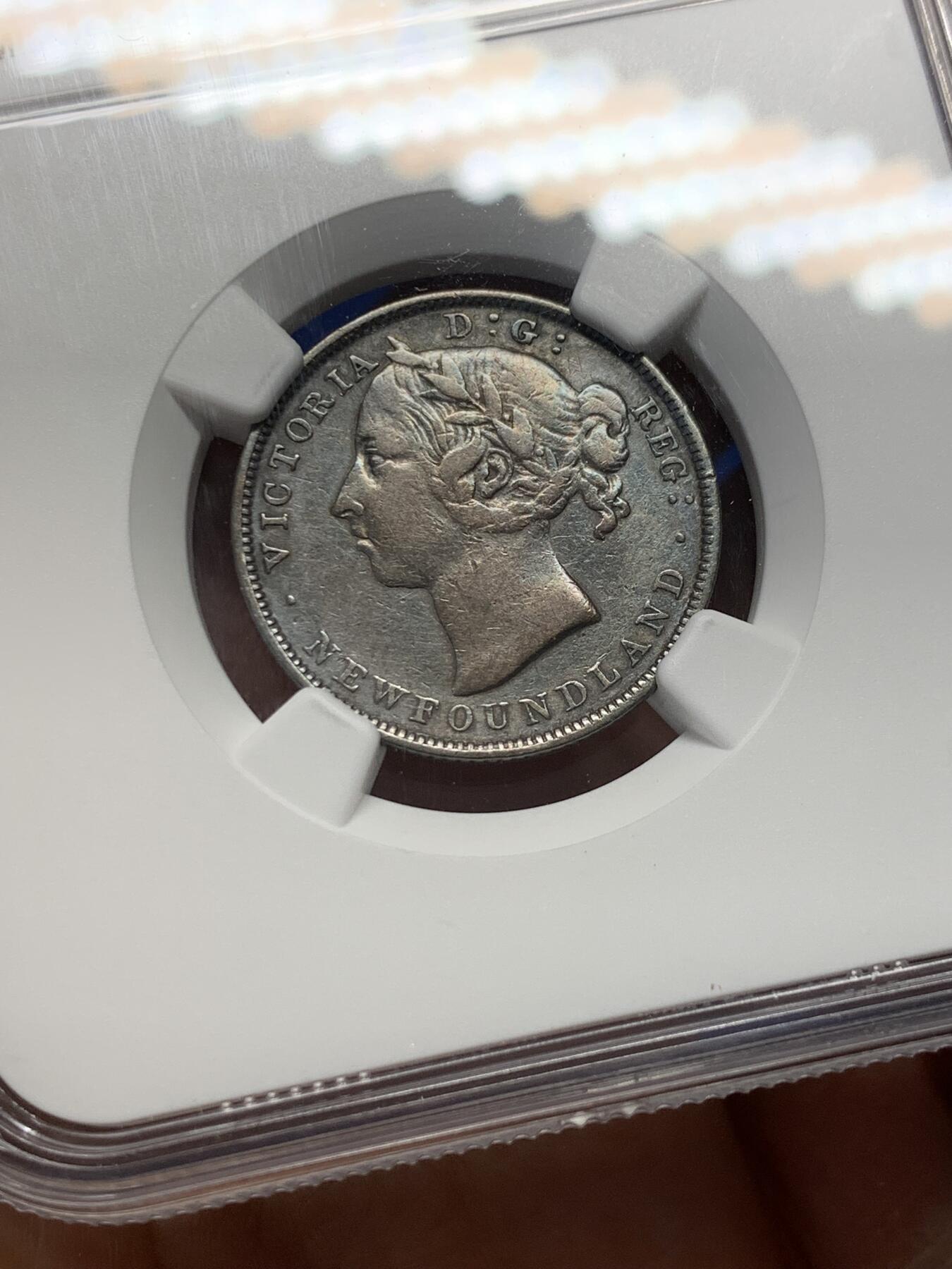 《竞宝斋》第347场 周日，周一，周二  3场连拍 （全场包邮） NGC VF 纽芬兰1899年20分银币，稀见品种，少见小维头像。纽芬兰书价高，头像清晰的已颇有难度