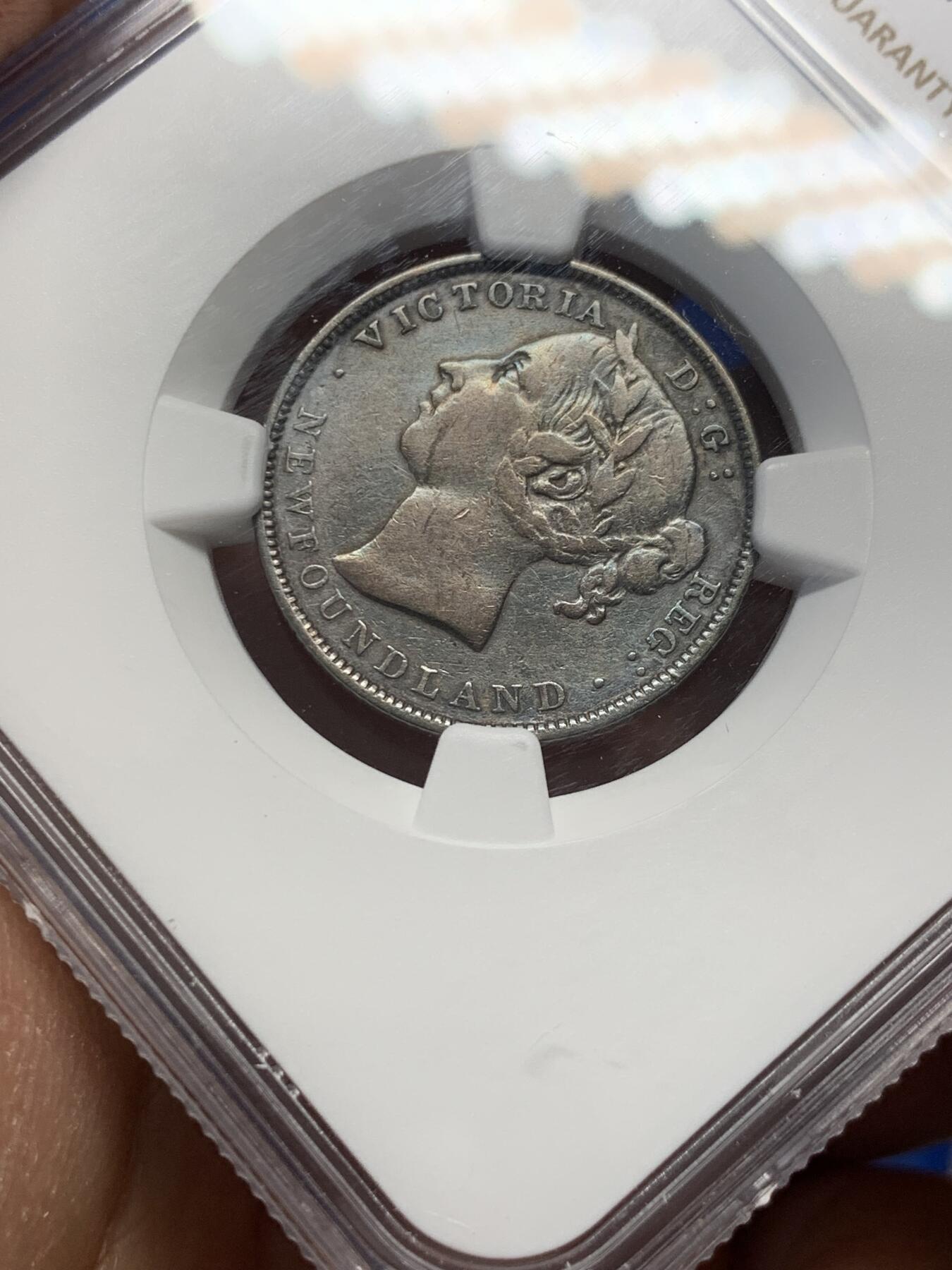《竞宝斋》第347场 周日，周一，周二  3场连拍 （全场包邮） NGC VF 纽芬兰1899年20分银币，稀见品种，少见小维头像。纽芬兰书价高，头像清晰的已颇有难度