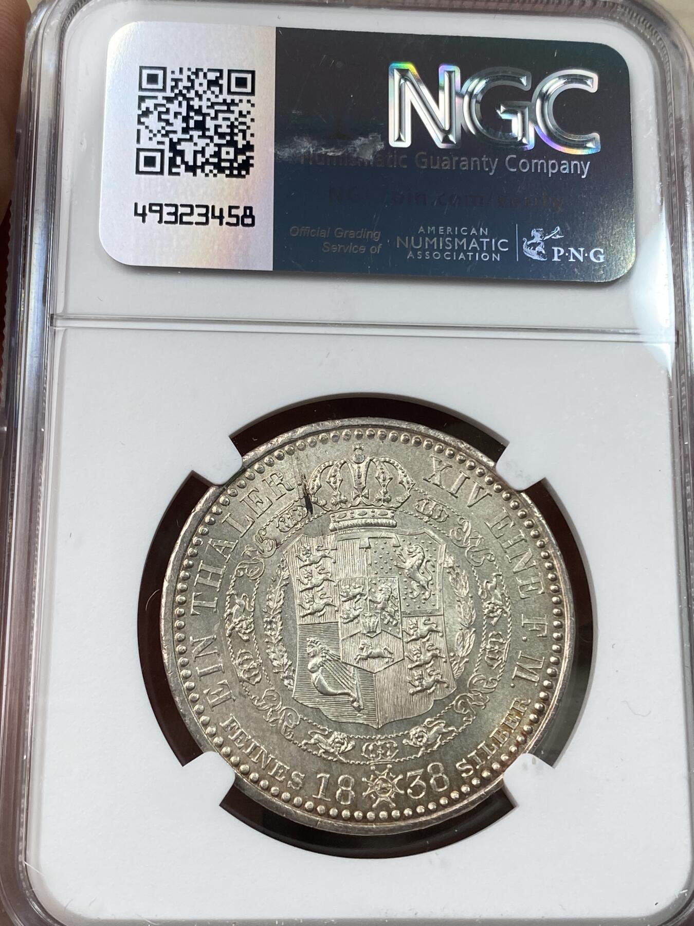 万国钱币拍卖第041期 NGC MS64 1838年德国汉诺威奥古斯特一世大头版英式盾徽流通1泰勒 超神全深打丝绸底板唯一亚军分 高品难度相当大的品种