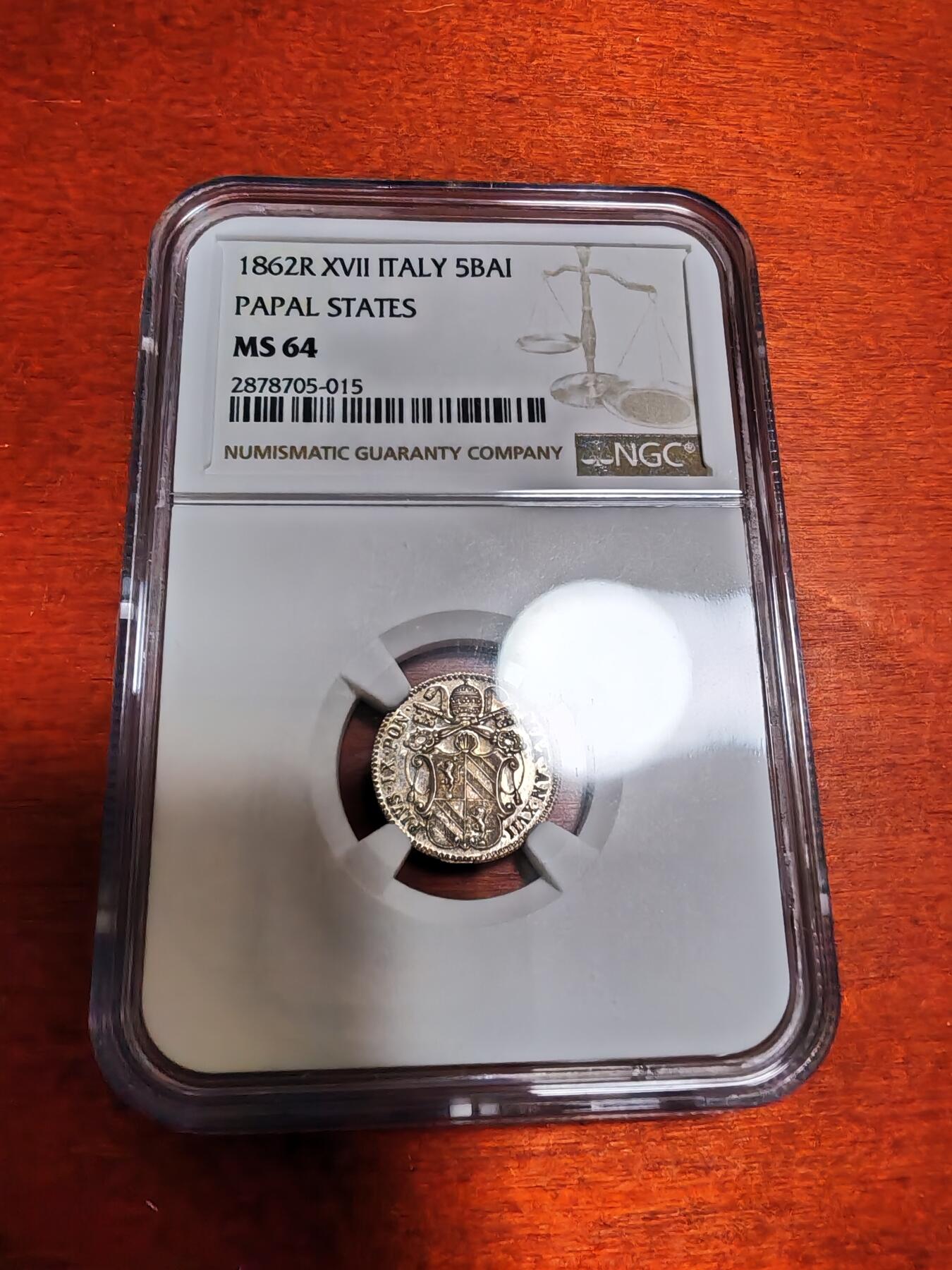 长老汇龙年精选第四十九场拍卖 1862R XVII 意大利教皇国 5B银币，NGC MS64分，唯一冠军分，远远领先第二名53分，克书XF40标价150美金，镜面感十足