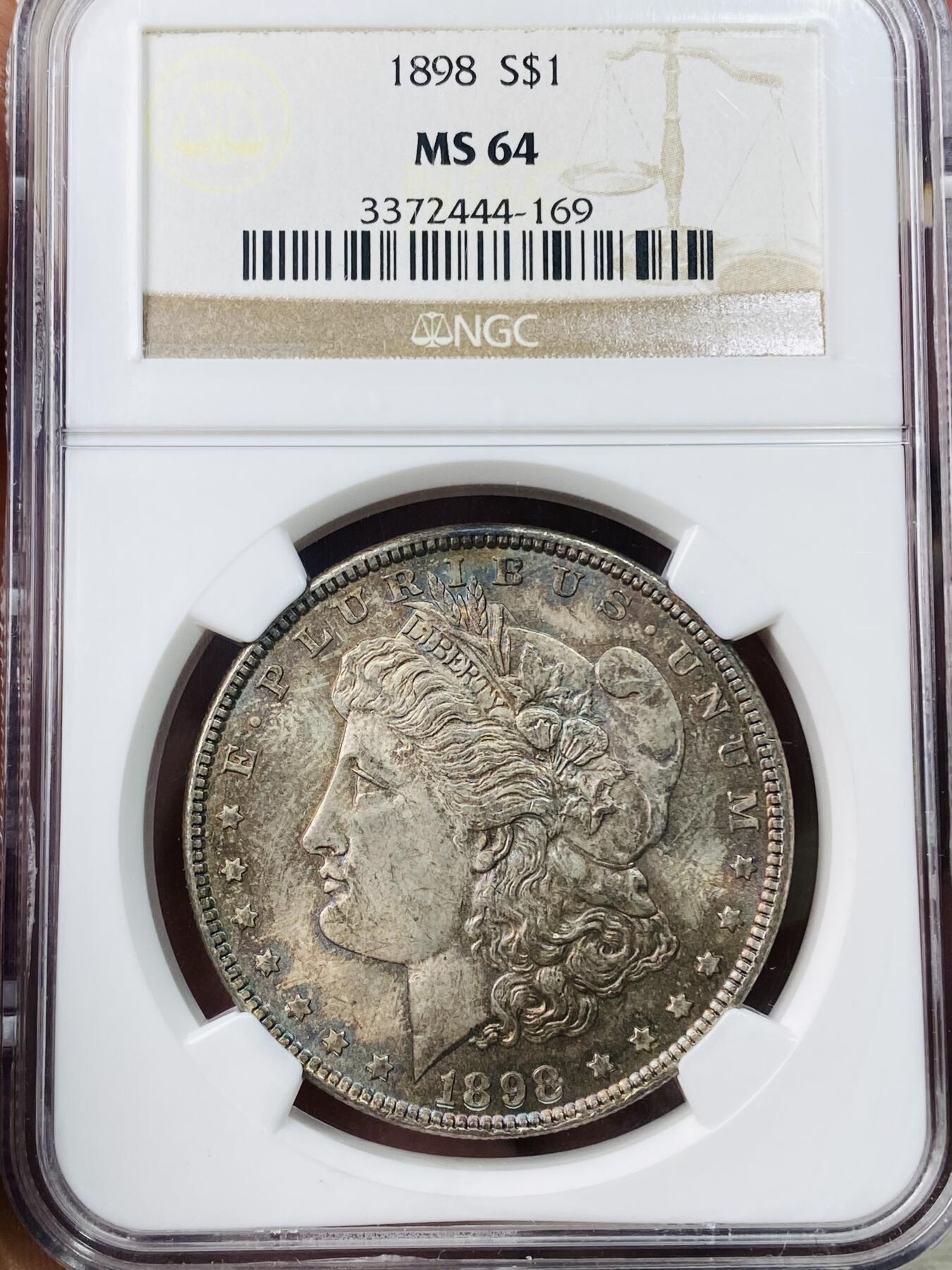万国钱币拍卖第042期（蛇年首拍） NGC MS64 1898年美国摩根1元大银币 五彩倒影包浆极致体验