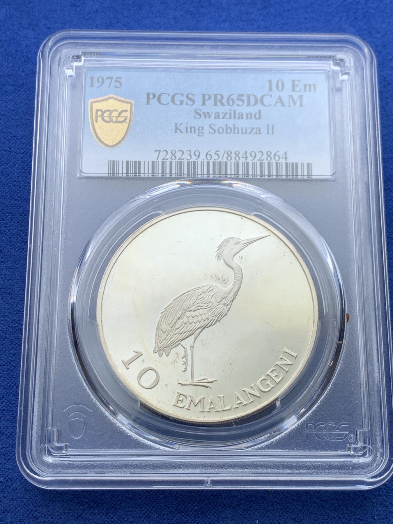 《竞宝斋》第352场 周日，周一 2场连拍 （全场包邮） 唯一冠军分 PCGS PR65DCAM 斯威士兰1975年索不扎二世国王诞辰75周年10里兰吉尼精制大银币，铸造量仅1500枚，购于英国老藏家，盒证齐全