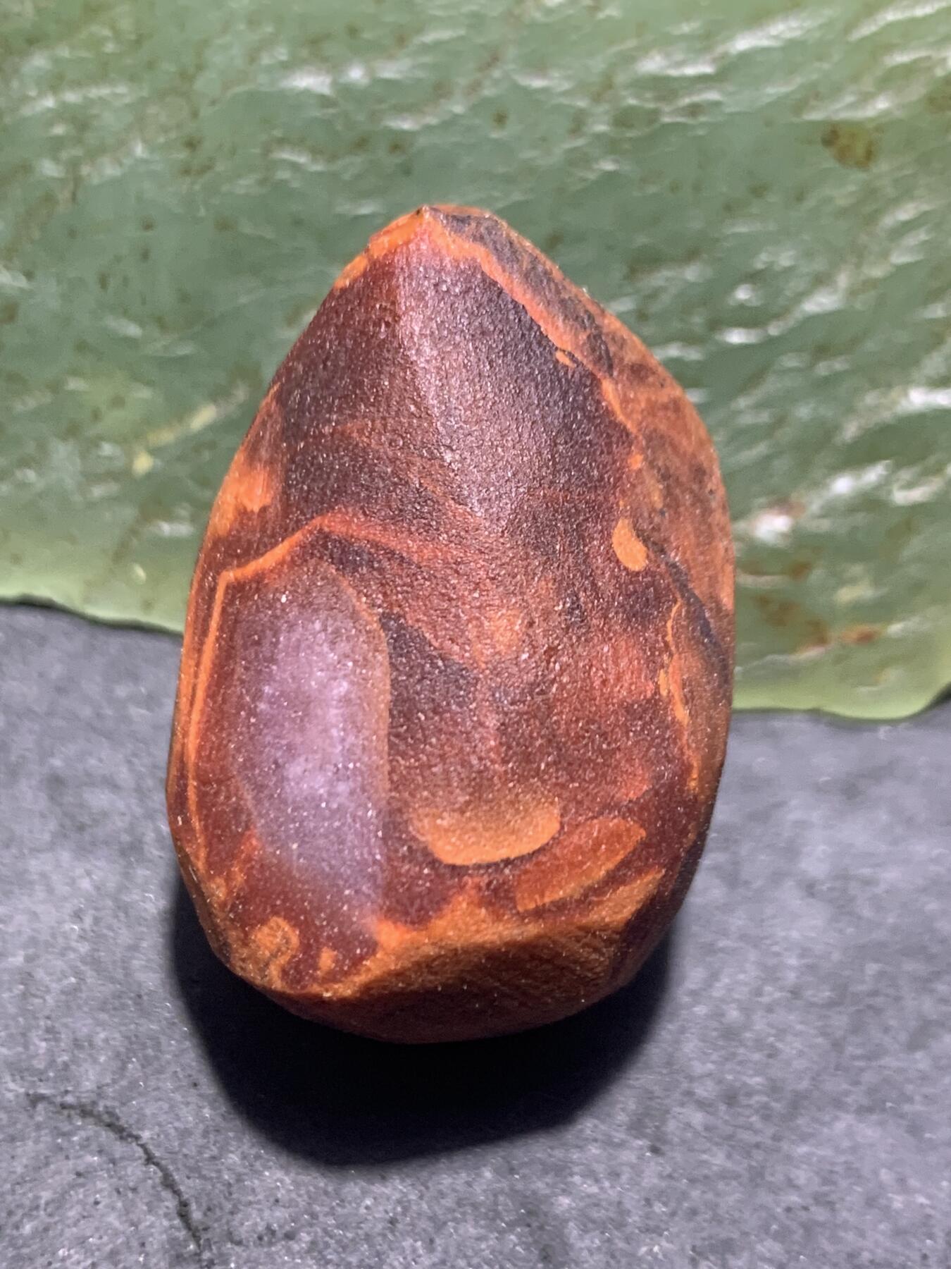 精美带皮冰飘柿子红南红玛瑙明料原石一颗