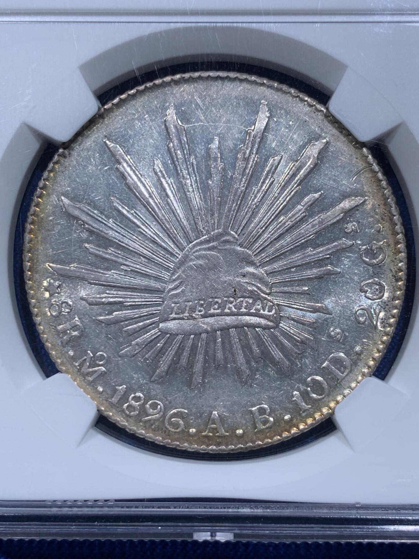 《竞宝斋》第354场 周日，周一，周二 3场连拍 （全场包邮） NGC MS62 墨西哥 1896年 MO厂AB版花边鹰洋8R银币（稀有版别，只铸造了1895/1896共2个年份，亮眼的环彩包浆，状态极佳）