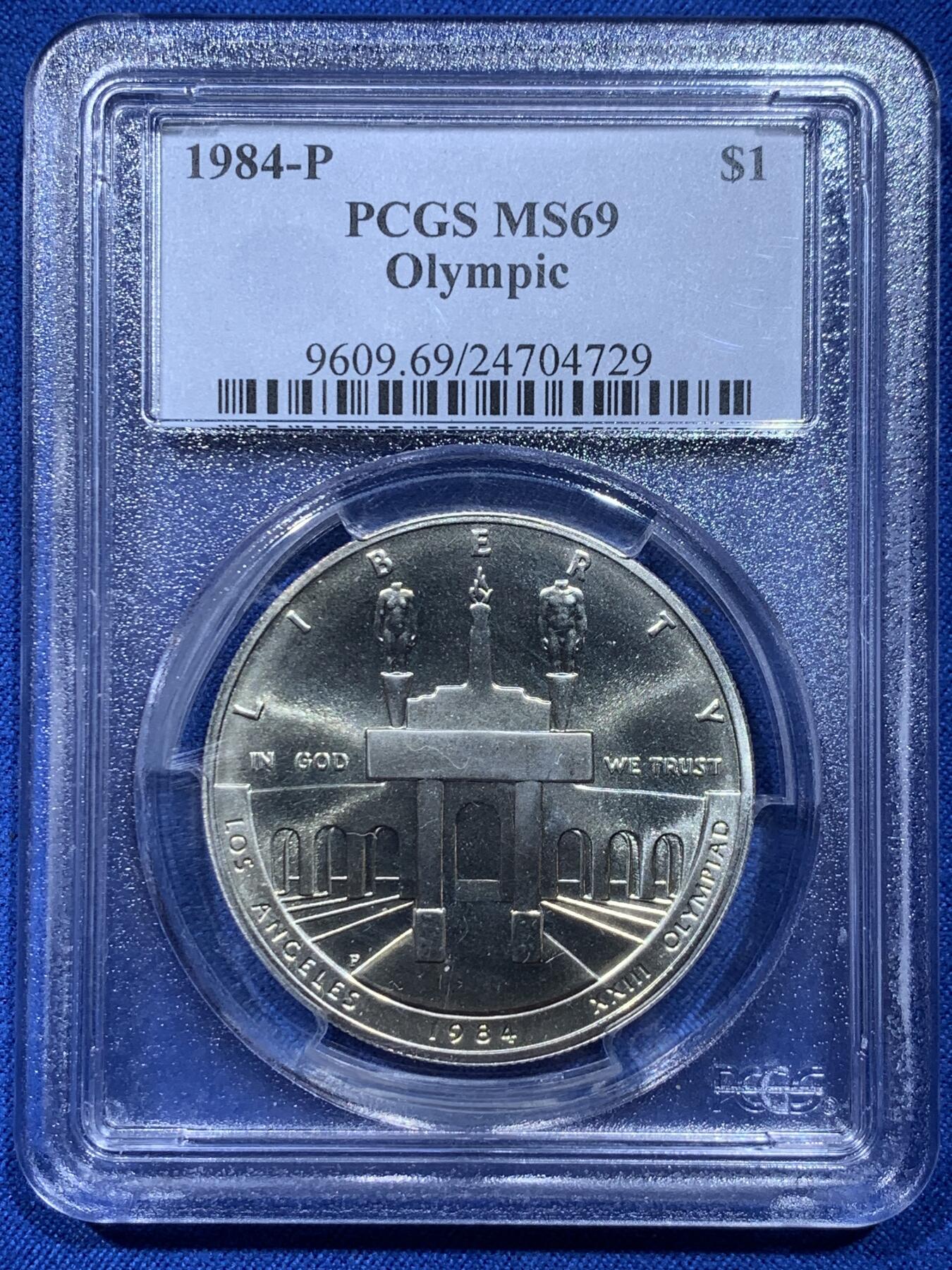 《竞宝斋》第354场 周日，周一，周二 3场连拍 （全场包邮） PCGS MS69 美国1984年洛杉矶奥运会奥运竞技场/雄鹰1美元纪念银币，币面清爽干净又漂亮，状态极佳。