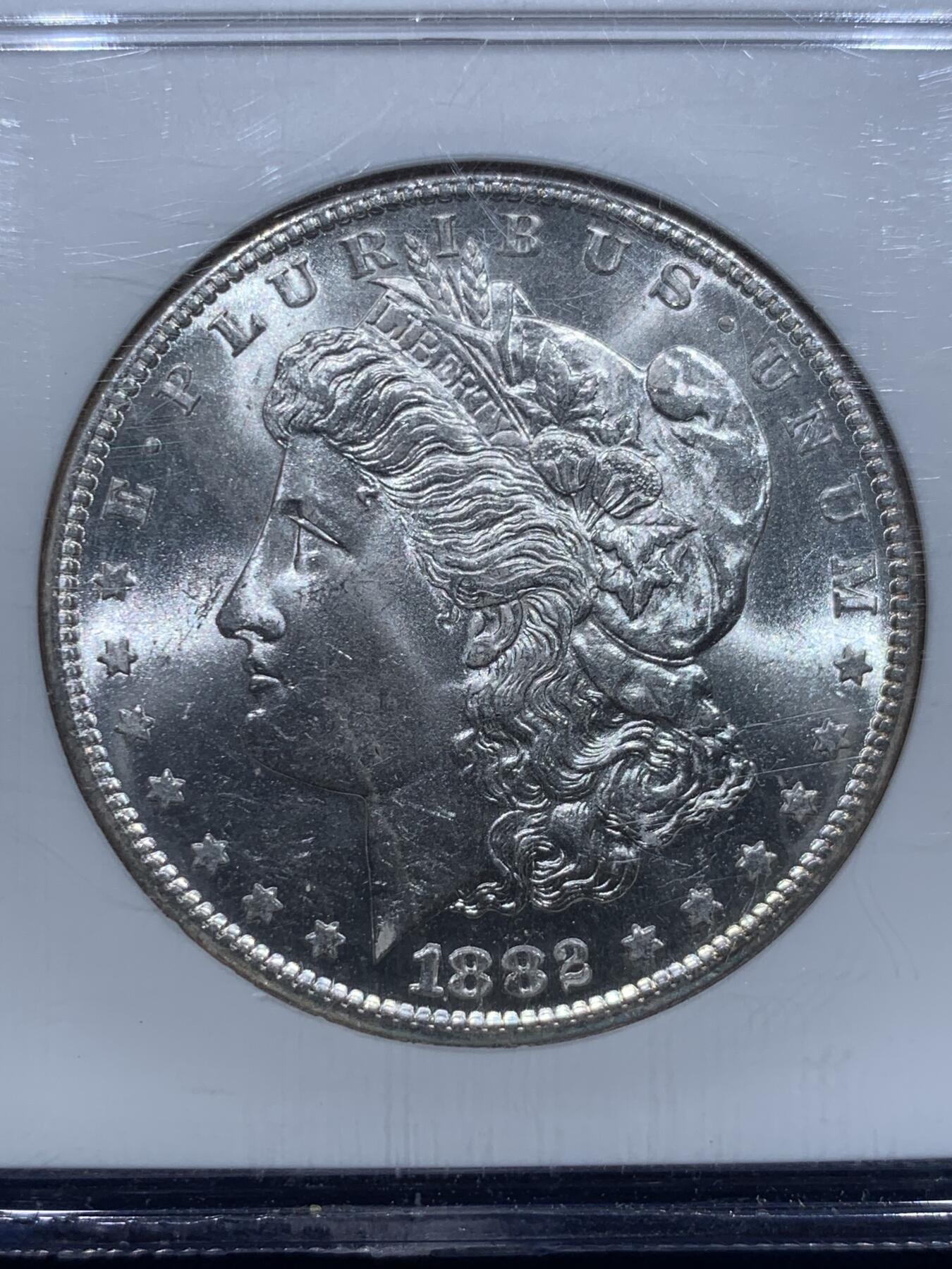 《竞宝斋》第353场 周日，周一，周二 3场连拍 （全场包邮） NGC MS64 美国1882年1美元摩根银币，S厂出品，光度好，老盒。