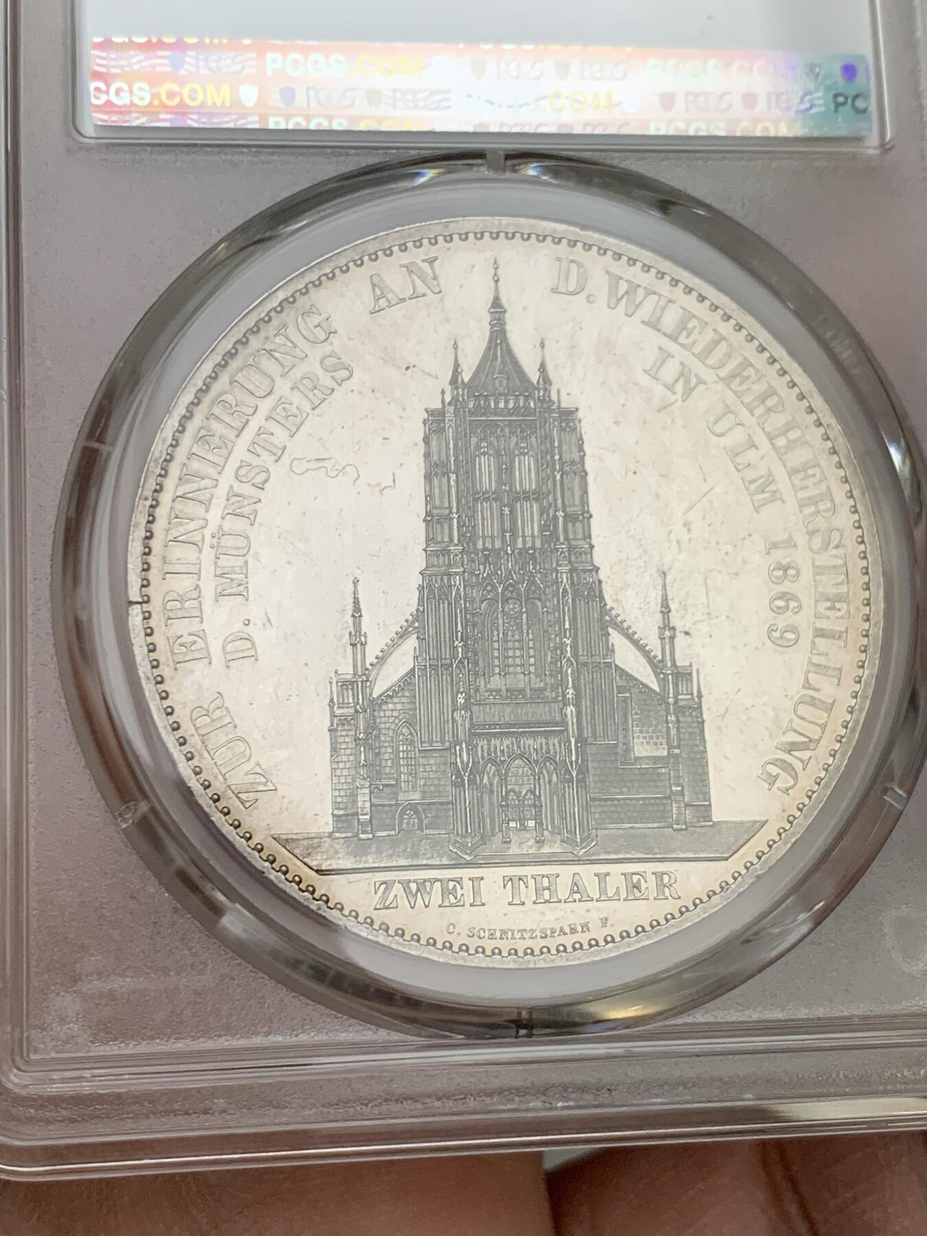 《竞宝斋》第356场 周日，周一  2场连拍 （全场包邮） PCGS-PR62（纯银版）德国符腾堡1869年2泰勒乌尔姆教堂大银币。1869年纯银精制版发行量为80枚，此币重量33.5克，是69年ngc冠军分，由于喜欢PCGS外观所以换盒、但遗憾是PCGS对于教堂没有专门的纯银标注，所以保留NGC标签，附NGC记录