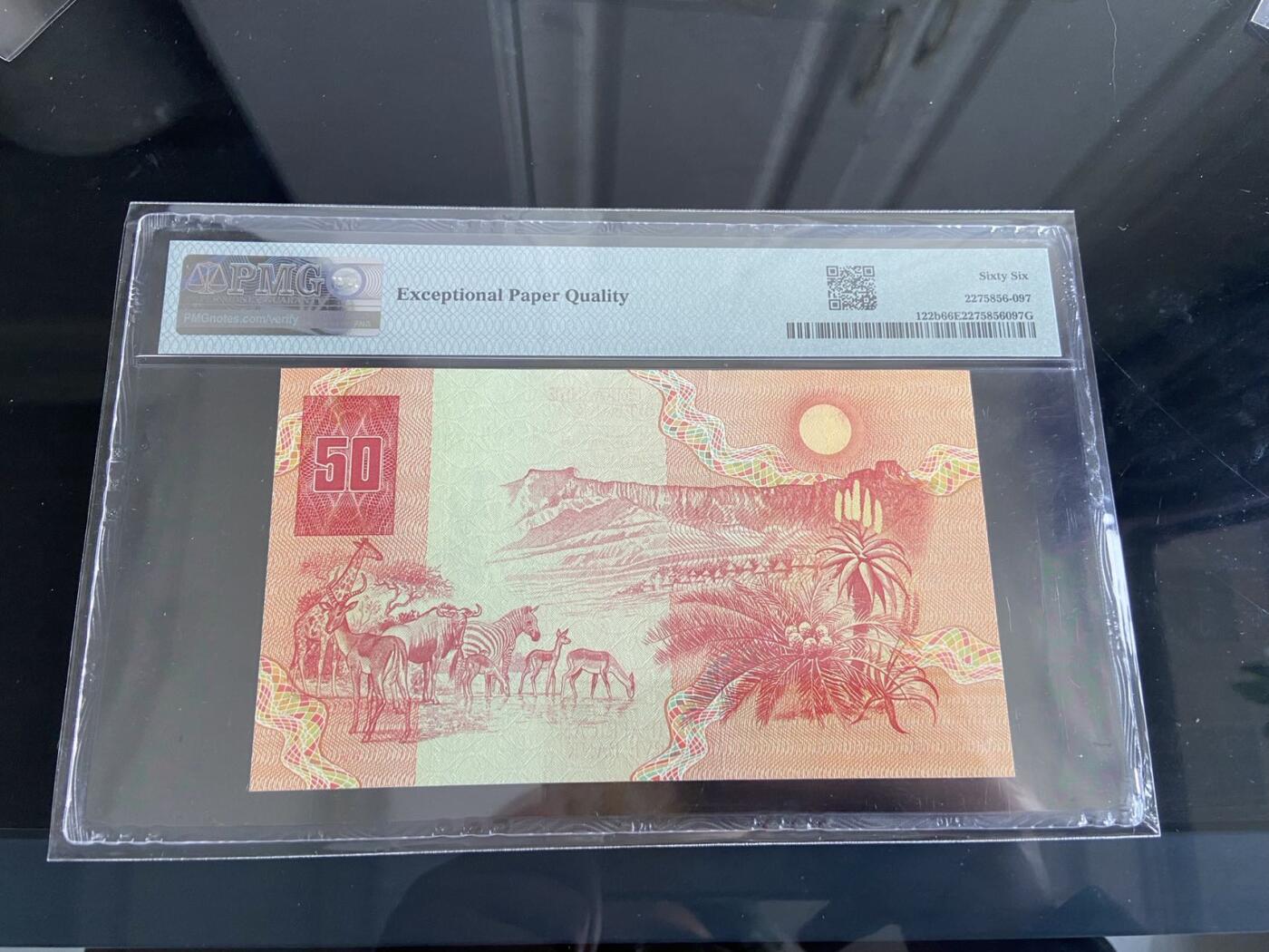 【炜奕收藏】，第二十六期 南非早期50兰特，PMG评级