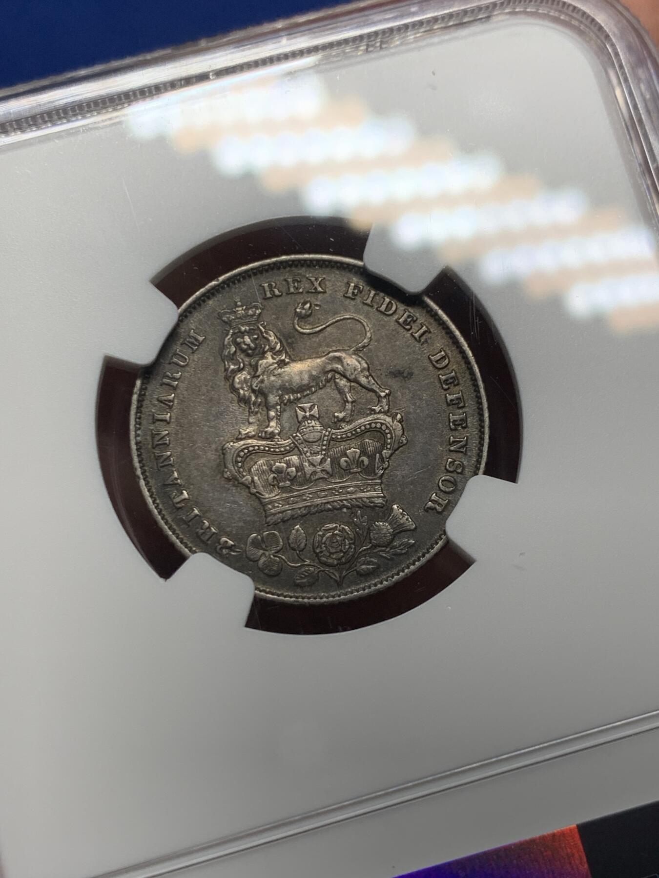 《竞宝斋》第358场 周日，周一  2场连拍 （全场包邮） NGC XF45 英国1825年乔治四世1先令银币 酱彩包浆 出分不易 背面的小狮子很可爱