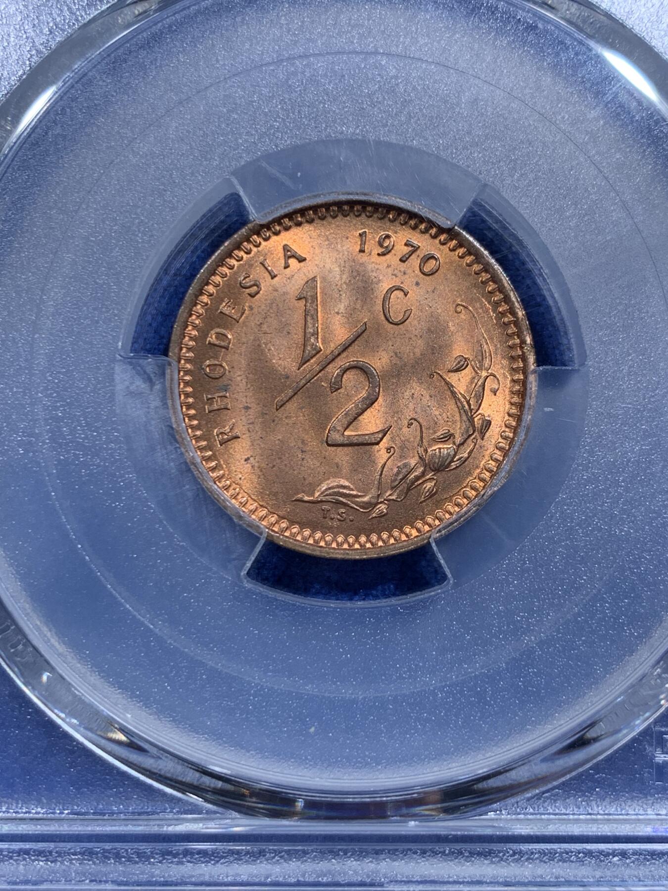 《竞宝斋》第359场 周日，周一  2场连拍 （全场包邮） PCGS MS64RD 罗德西亚1970年半分小铜币 RD状态很难的 两面柔和转光 国徽浮雕感很强 富有非洲风情 可藏！