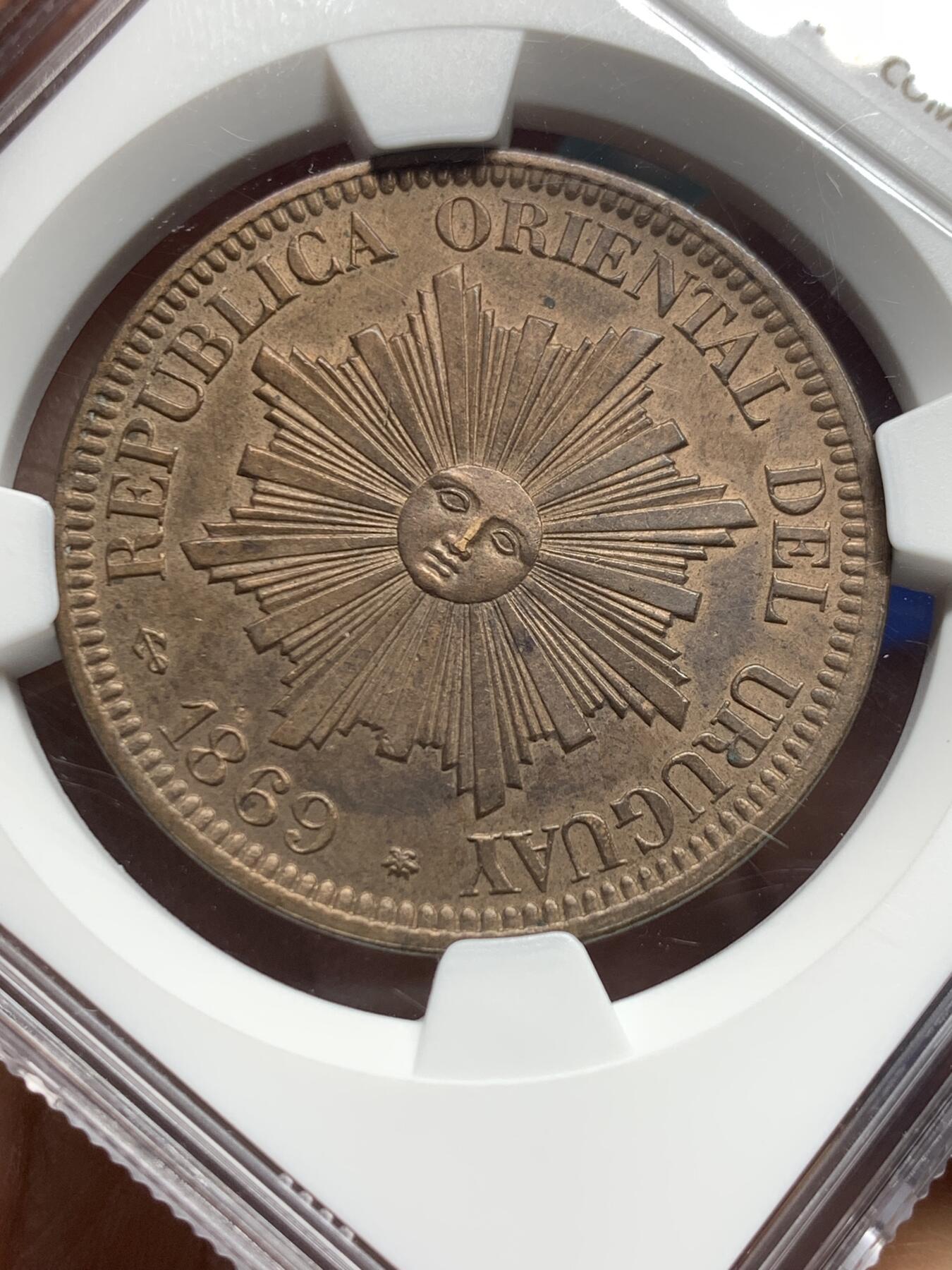 《竞宝斋》第360场 周日，周一  2场连拍 （全场包邮） NGC UNC 1869A 乌拉圭4分大铜币，稀少版别知名的A厂出品发行量最少， 币面笑脸高点俱在，细节到位，值得拥有。