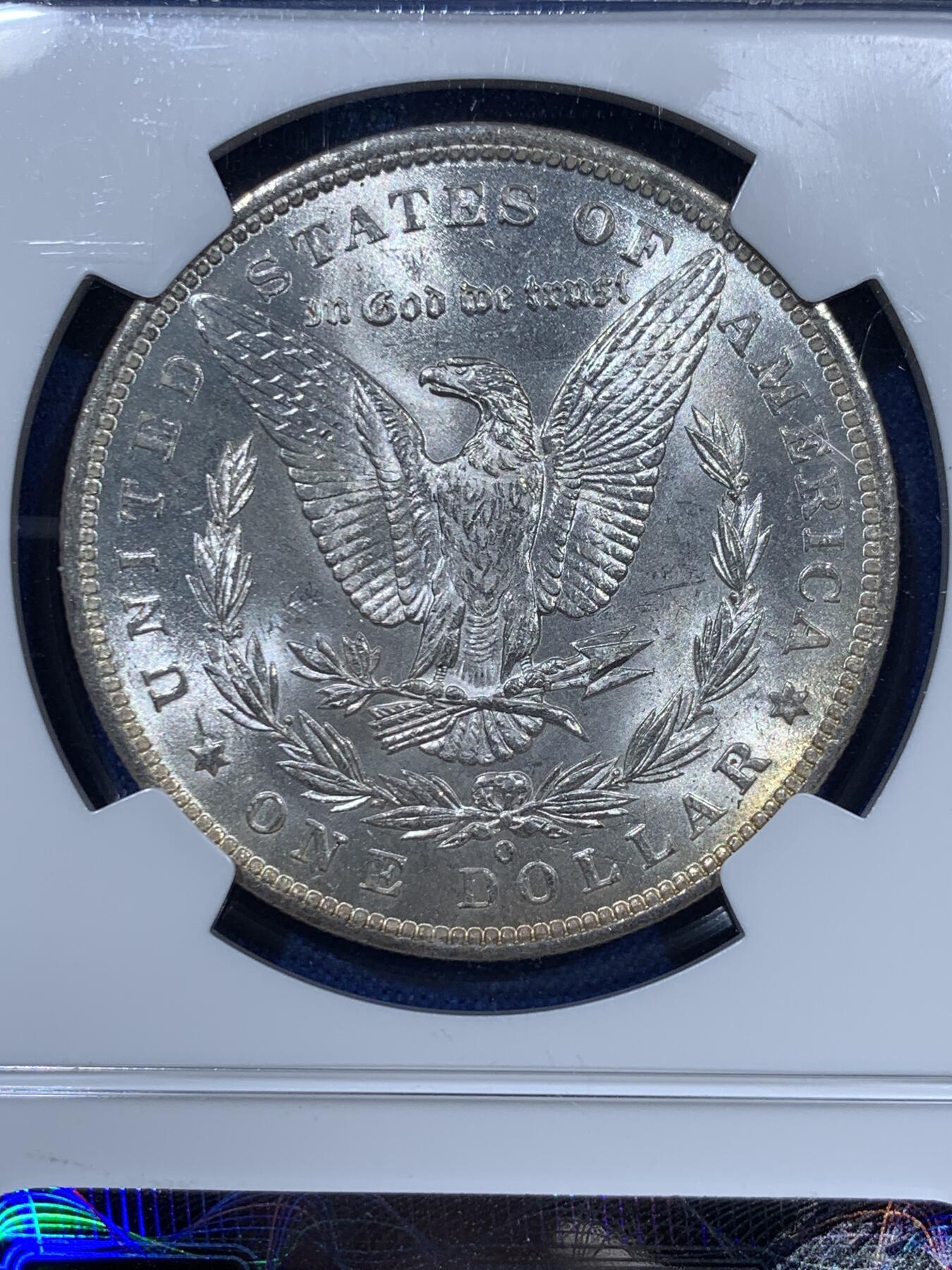 《竞宝斋》第360场 周日，周一  2场连拍 （全场包邮） NGC MS63 美国1885年O版摩根大银币，漂亮转光，O版鹰毛打这么完整不容易，鹰面细节深打浮雕感