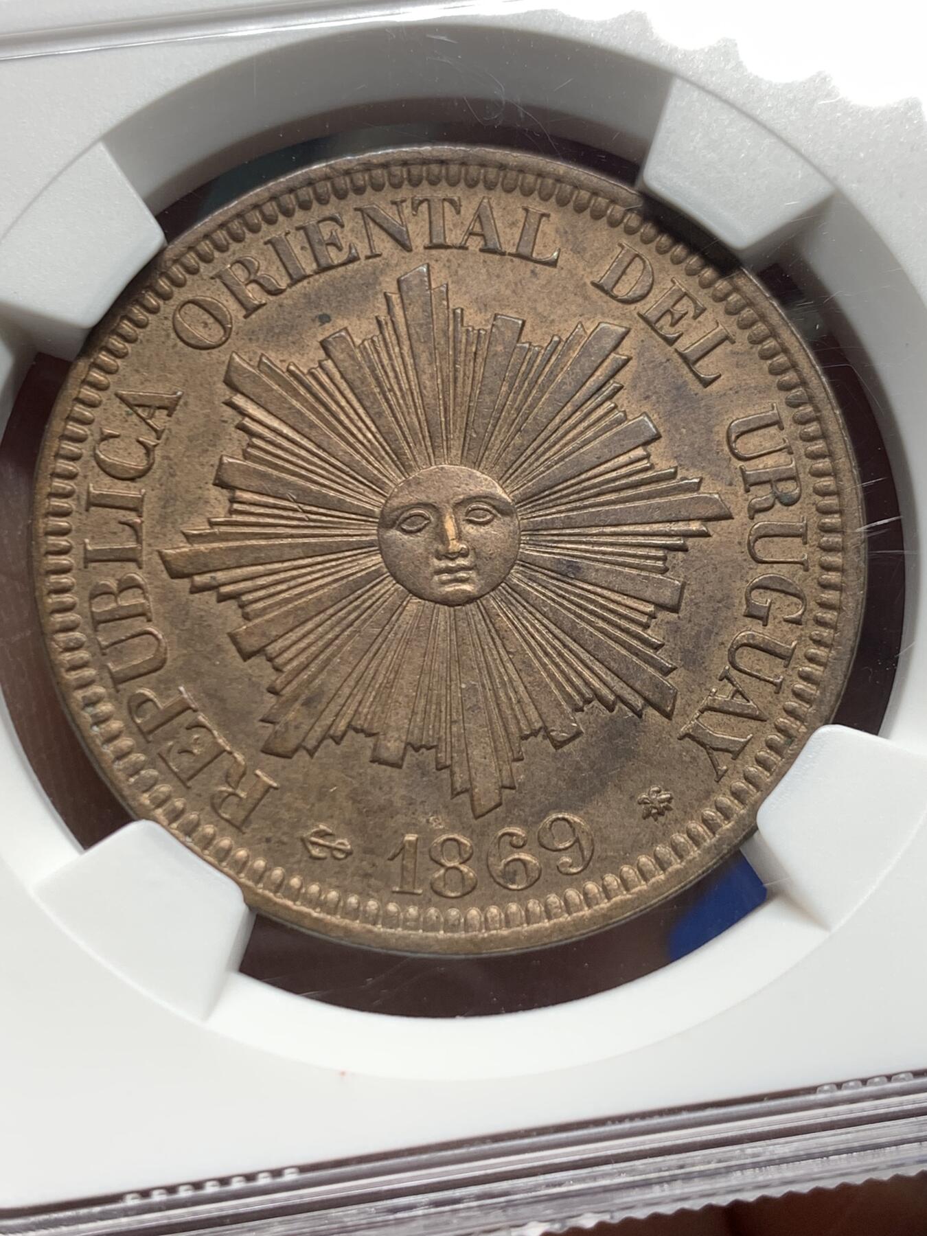 《竞宝斋》第360场 周日，周一  2场连拍 （全场包邮） NGC UNC 1869A 乌拉圭4分大铜币，稀少版别知名的A厂出品发行量最少， 币面笑脸高点俱在，细节到位，值得拥有。