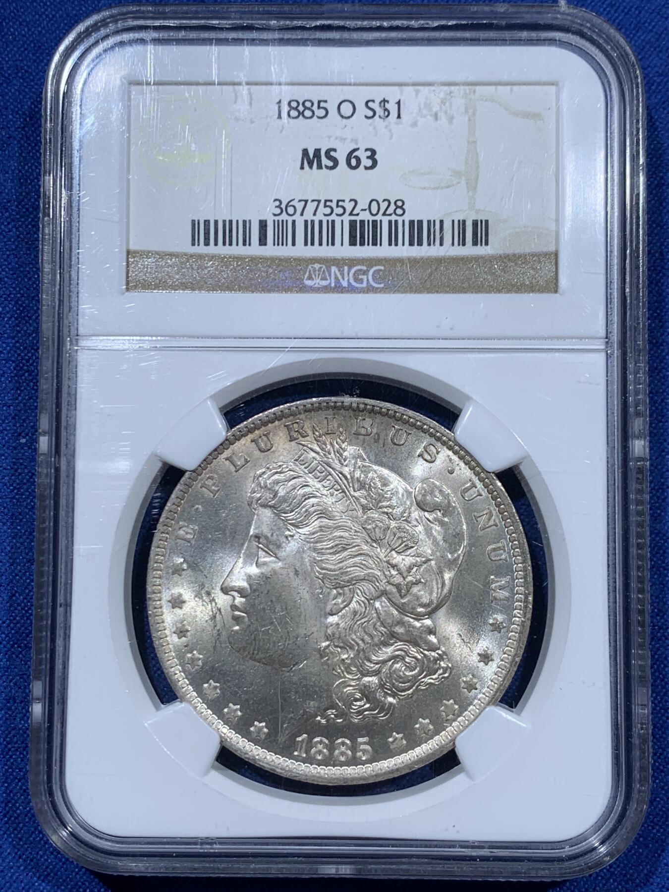 《竞宝斋》第360场 周日，周一  2场连拍 （全场包邮） NGC MS63 美国1885年O版摩根大银币，漂亮转光，O版鹰毛打这么完整不容易，鹰面细节深打浮雕感