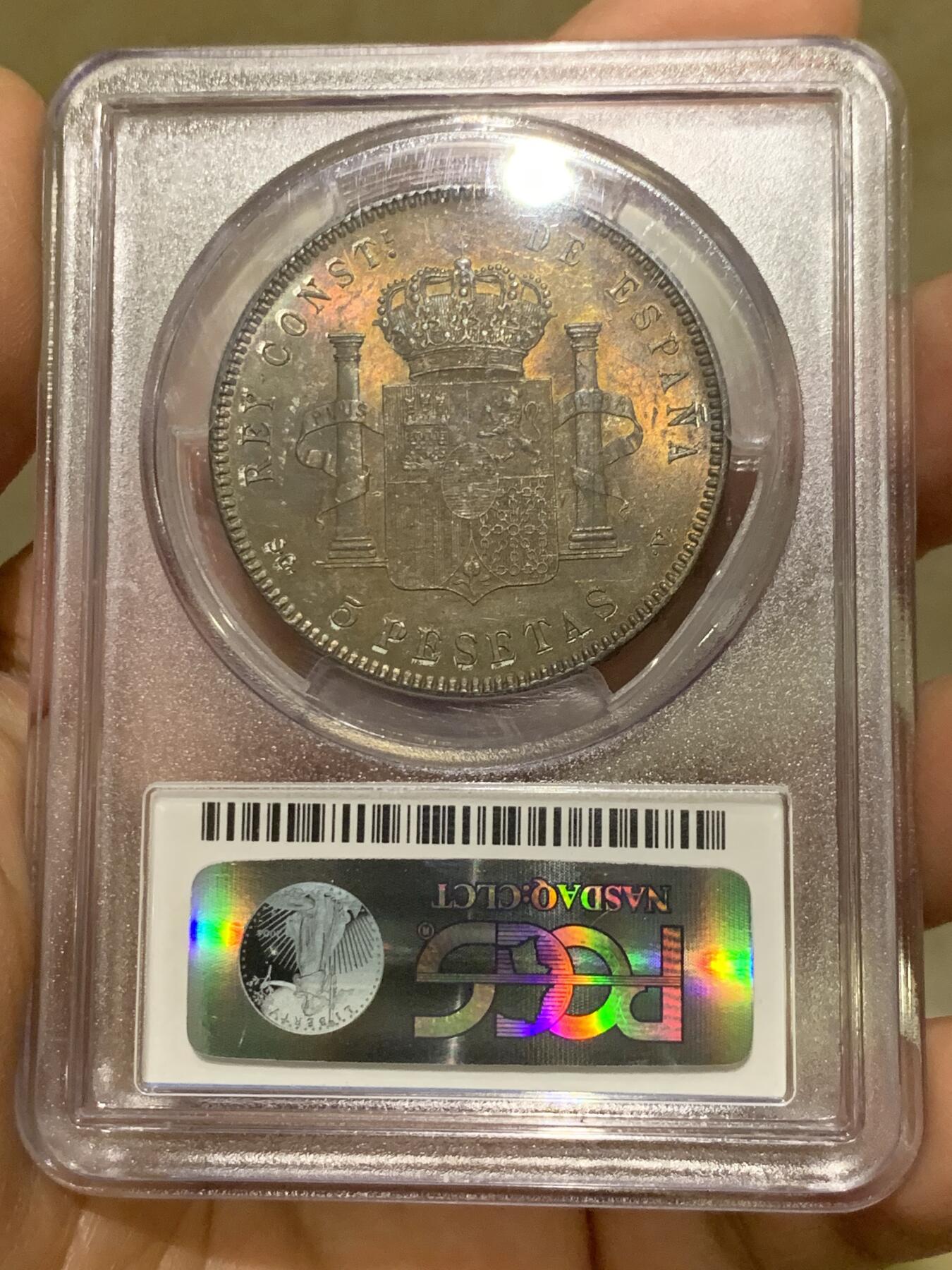 《竞宝斋》第360场 周日，周一  2场连拍 （全场包邮） PCGS MS63 西班牙1898年阿方索十三世小孩头双柱5比赛塔大银币，正反两面均有五彩包浆