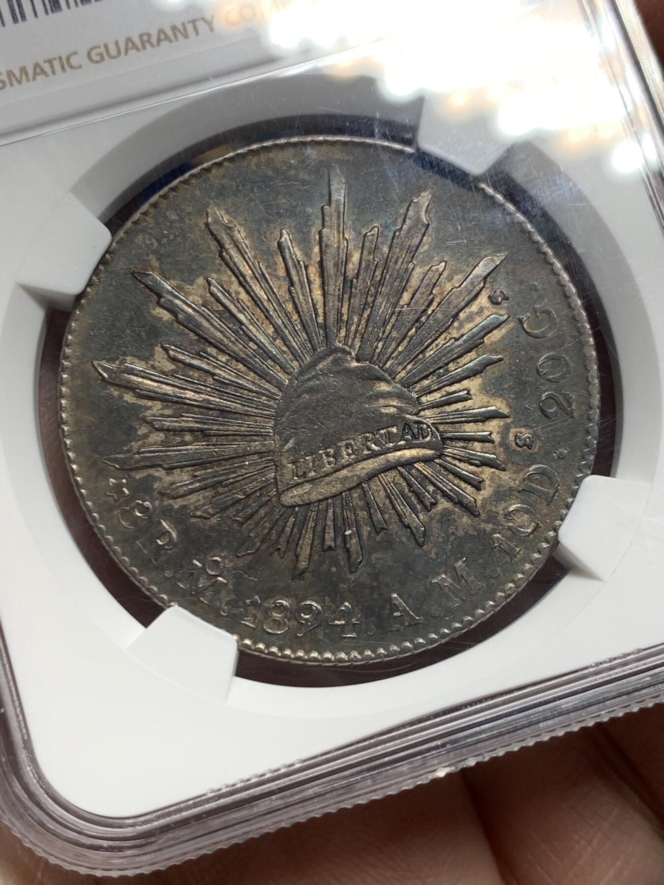 《竞宝斋》第360场 周日，周一  2场连拍 （全场包邮） NGC AUD 墨西哥1894年MO AM花边鹰洋8R银币 底板状态良好，无戳这样的上海老包浆已经很少了。