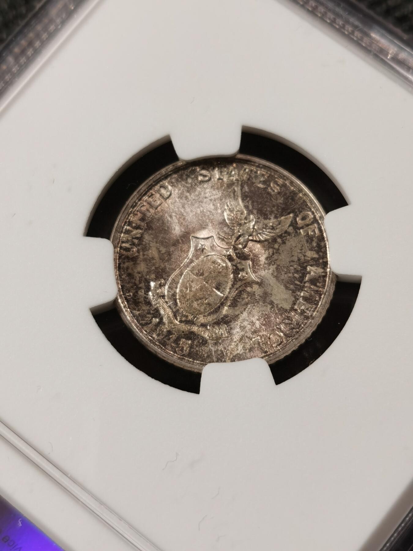 甄臻铺-世界钱币拍卖（第9期）新铺开张，欢迎捧场 NGC-MS65 1945年美属菲律宾20分银币，带包浆的高分少见