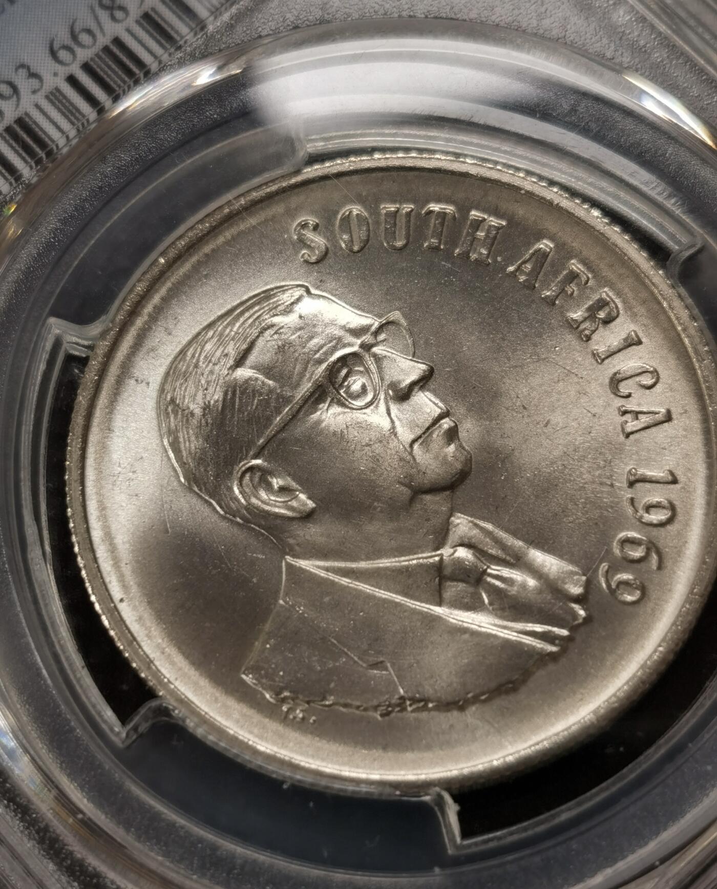 甄臻铺-世界钱币拍卖-南非西非东非专场（第10期）送拍享返佣金等优惠多多 PCGS-MS66 南非 1969 1兰特T.E.顿格斯纪念银币