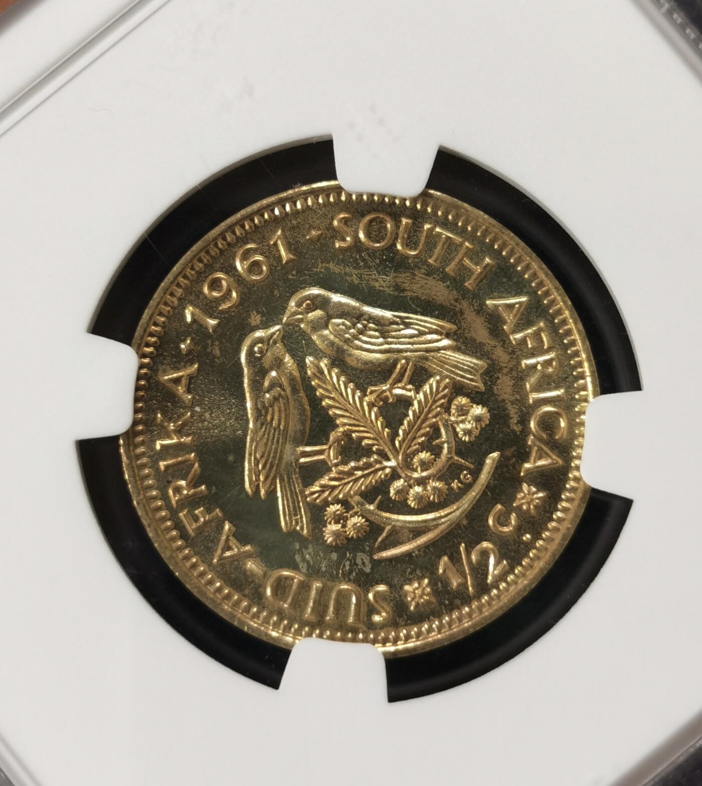 甄臻铺-世界钱币拍卖-南非西非东非专场（第10期）送拍享返佣金等优惠多多 NGC-PF64 南非 1961 1/2分 吕贝克首年精制铜币 币面转光，少见