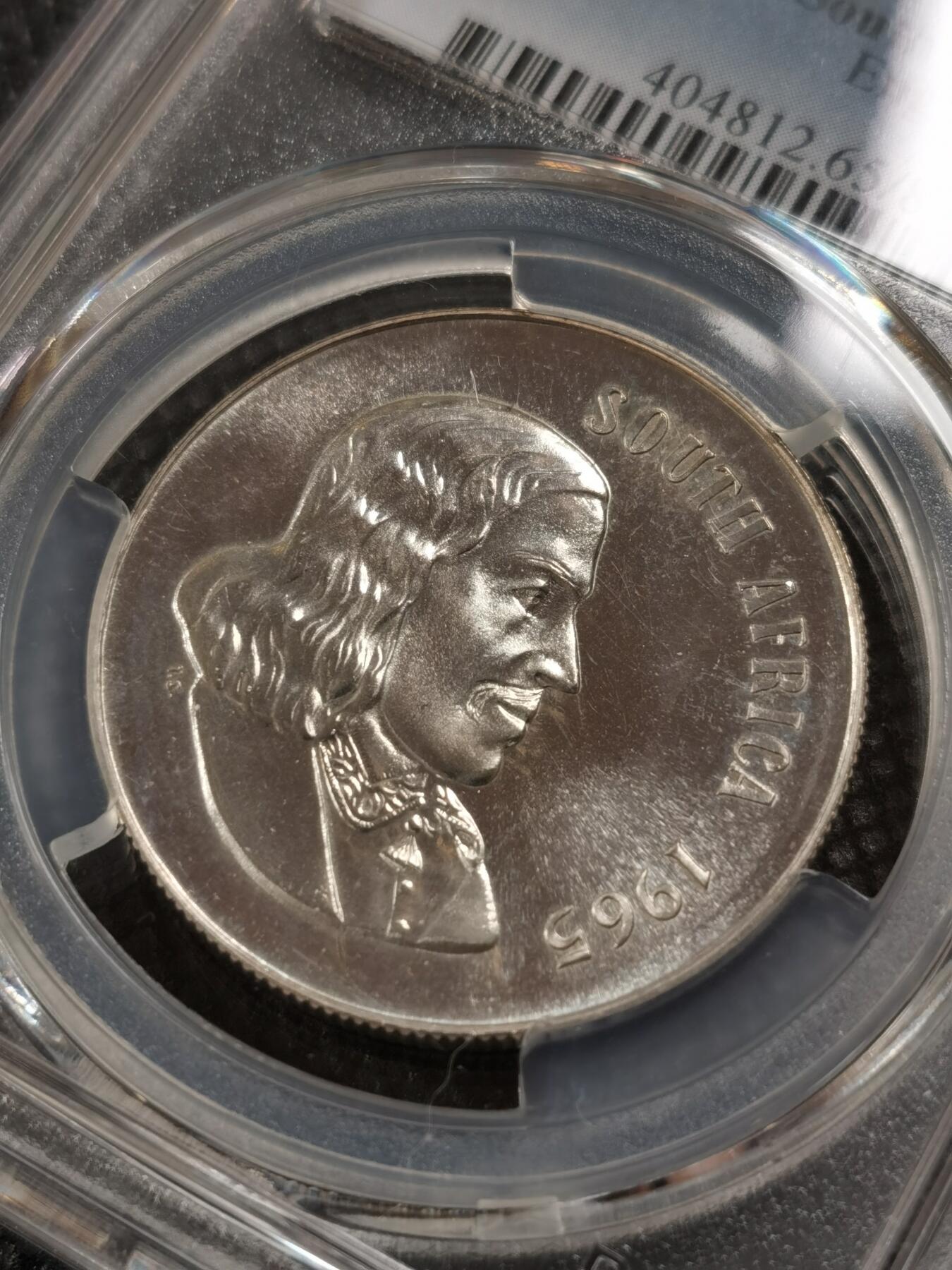 甄臻铺-世界钱币拍卖-南非西非东非专场（第10期）送拍享返佣金等优惠多多 PCGS-PR65 南非 1965 1兰特吕贝克精制银币，币面转光，收藏级