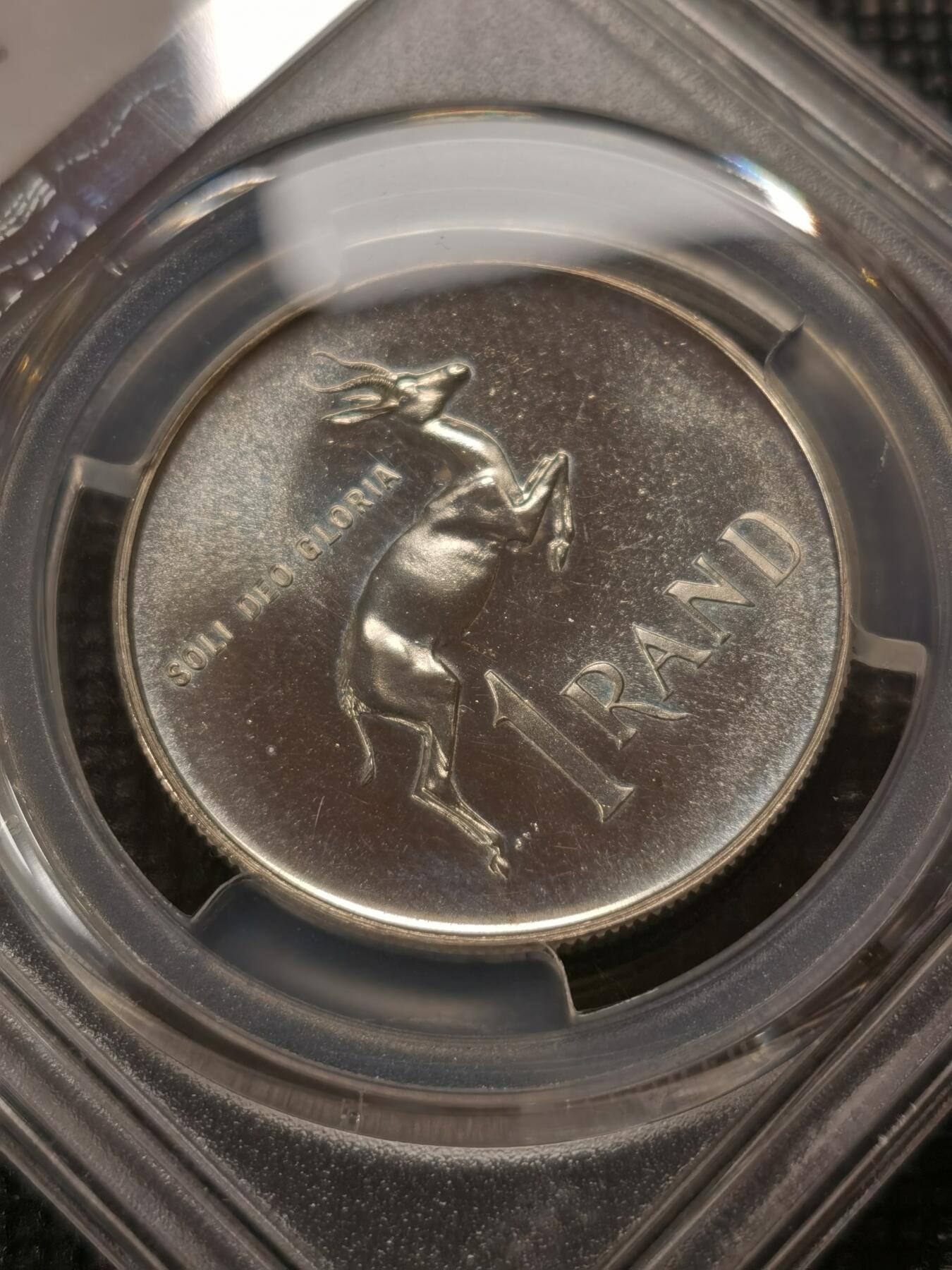 甄臻铺-世界钱币拍卖-南非西非东非专场（第10期）送拍享返佣金等优惠多多 PCGS-PR65 南非 1965 1兰特吕贝克精制银币，币面转光，收藏级