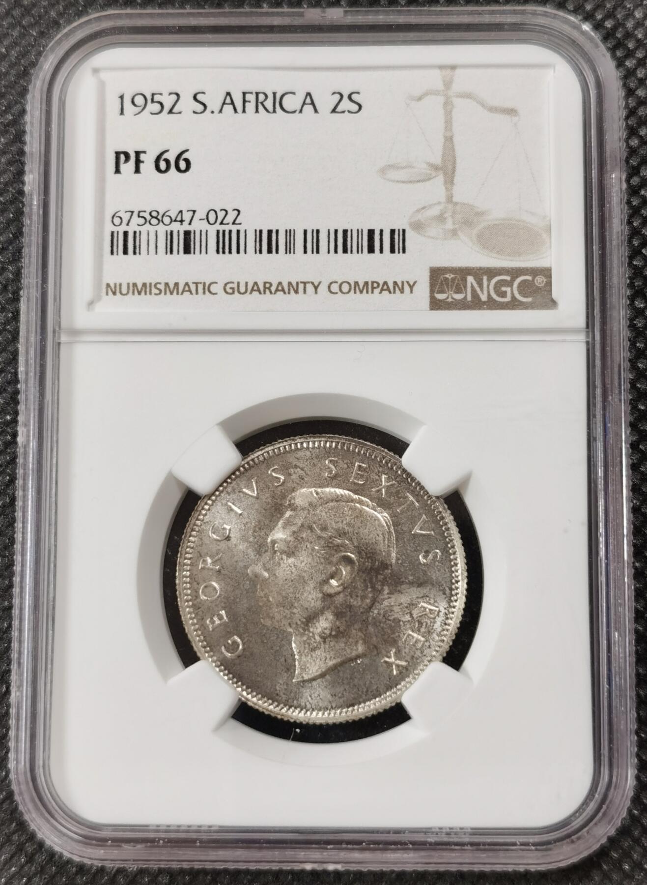 甄臻铺-世界钱币拍卖-南非西非东非专场（第10期）送拍享返佣金等优惠多多 NGC-PF66 英属南非 1952 2先令 银币精制 原味包浆，币面转光