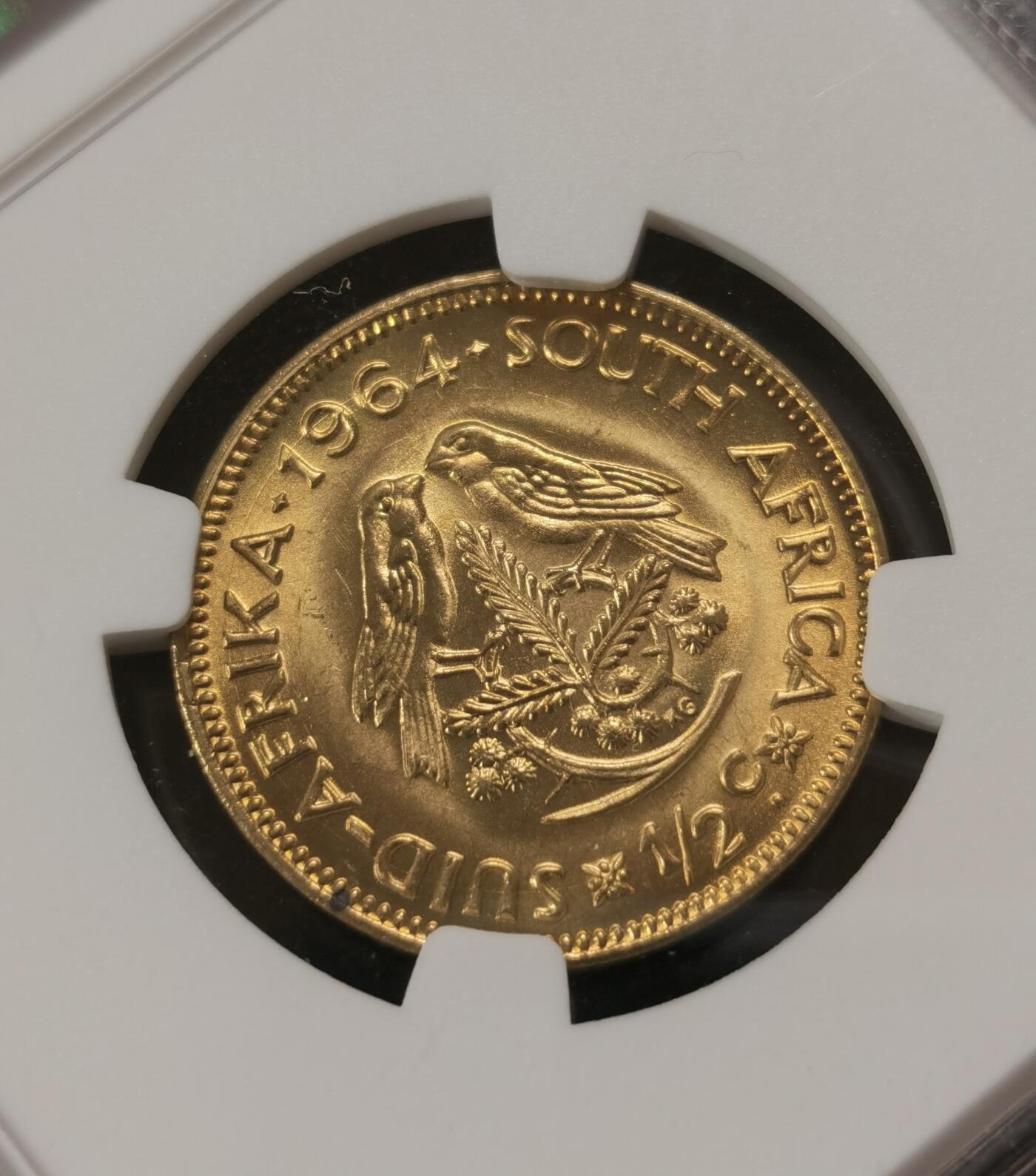 甄臻铺-世界钱币拍卖-南非西非东非专场（第10期）送拍享返佣金等优惠多多 NGC-MS67 南非 1964 1/2分 吕贝克铜币 币面转光，保存完好不易