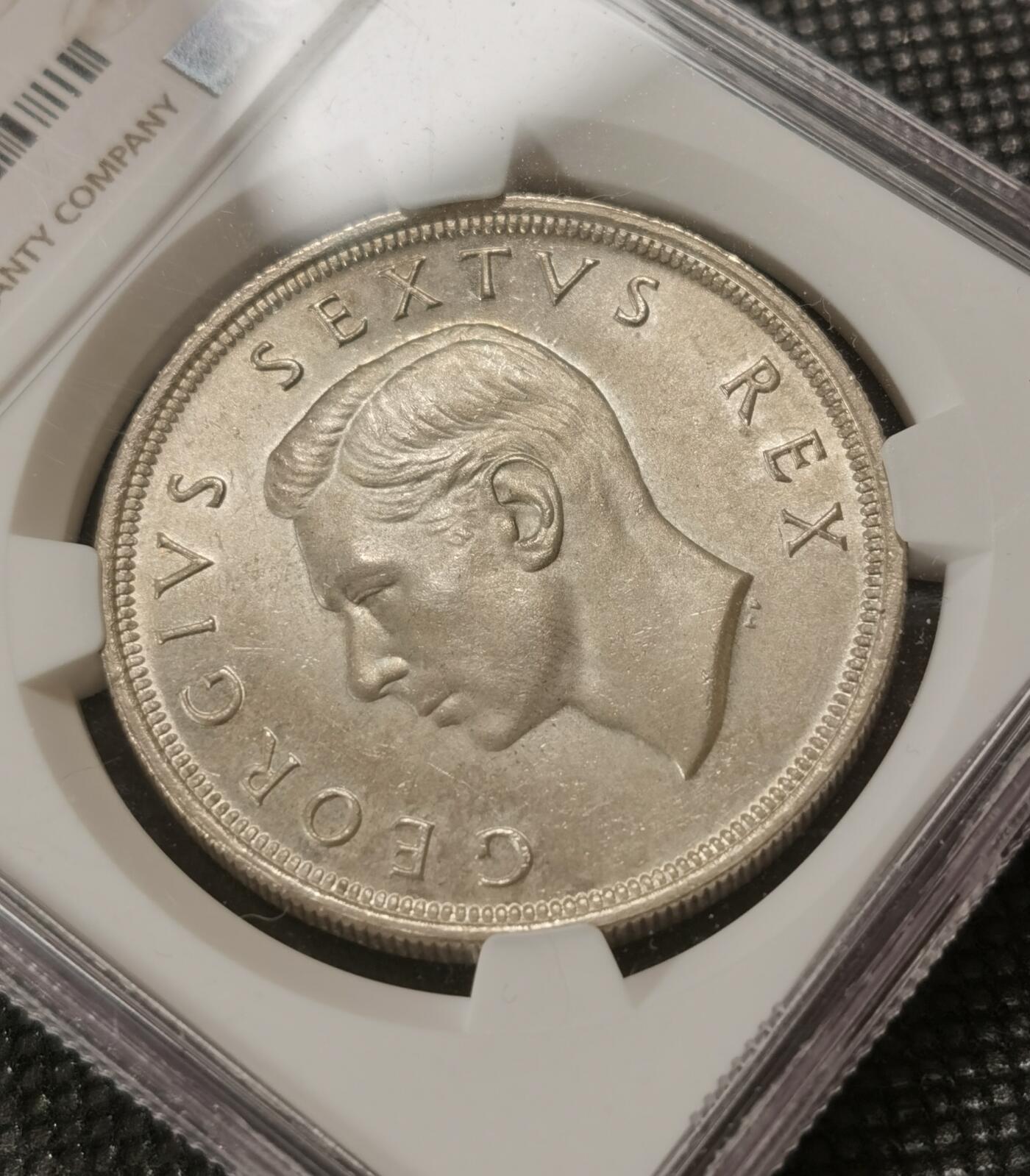 甄臻铺-世界钱币拍卖-南非西非东非专场（第10期）送拍享返佣金等优惠多多 NGC-MS64 南非 1952 乔治六世5先令 银币 发现开普敦300周年，品相难遇，大多63分，此枚64，自然淡黄油包浆