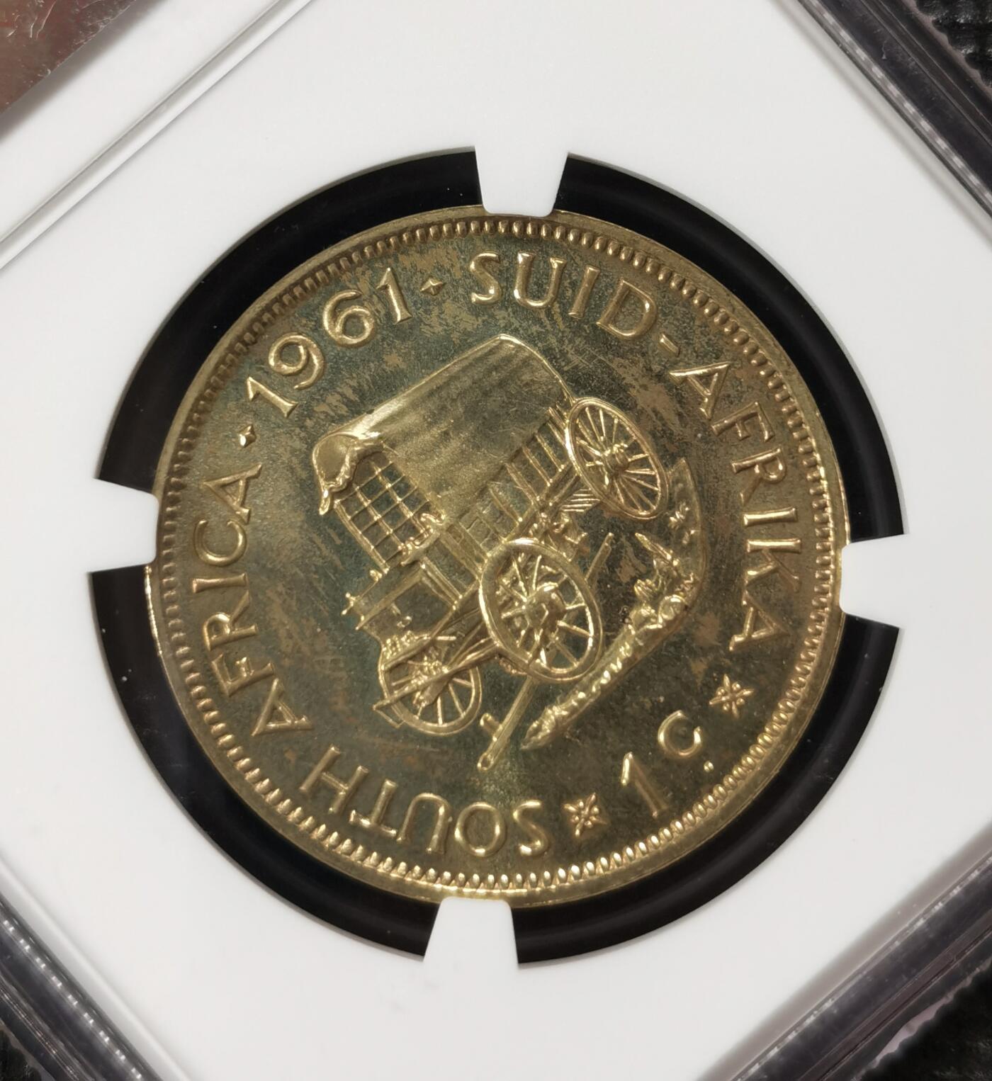 甄臻铺-世界钱币拍卖-南非西非东非专场（第10期）送拍享返佣金等优惠多多 NGC-PF63 南非 1961 1分 吕贝克首年精制铜币 币面转光，少见