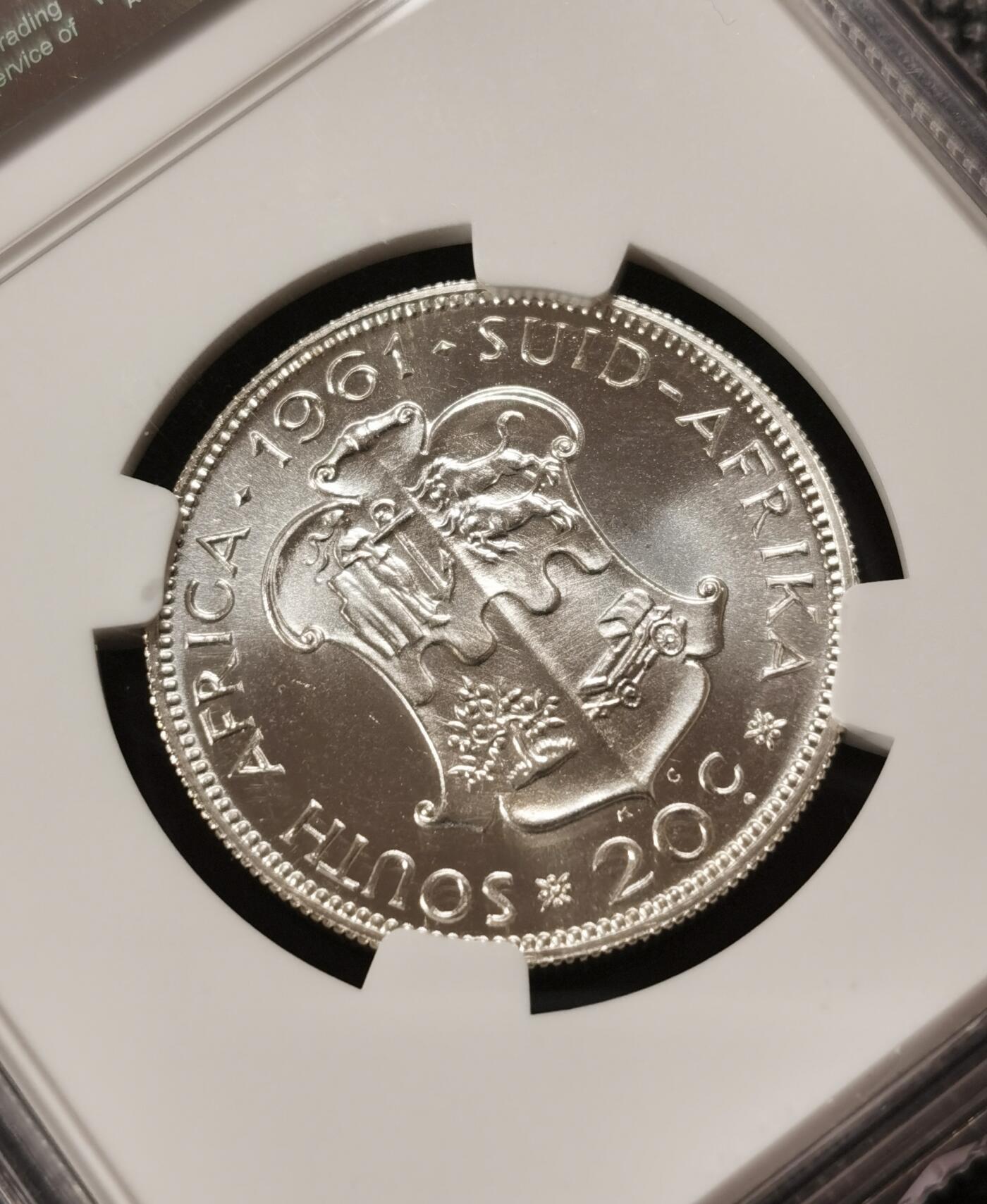 甄臻铺-世界钱币拍卖-南非西非东非专场（第10期）送拍享返佣金等优惠多多 NGC-PF67 南非 1961 20分 吕贝克首年精制银币 币面转光，少见