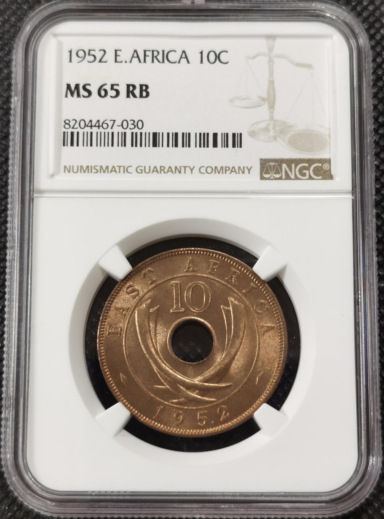 甄臻铺-世界钱币拍卖-南非西非东非专场（第10期）送拍享返佣金等优惠多多 NGC-MS65 英属东非 1952 10分 原味包浆，币面漂亮