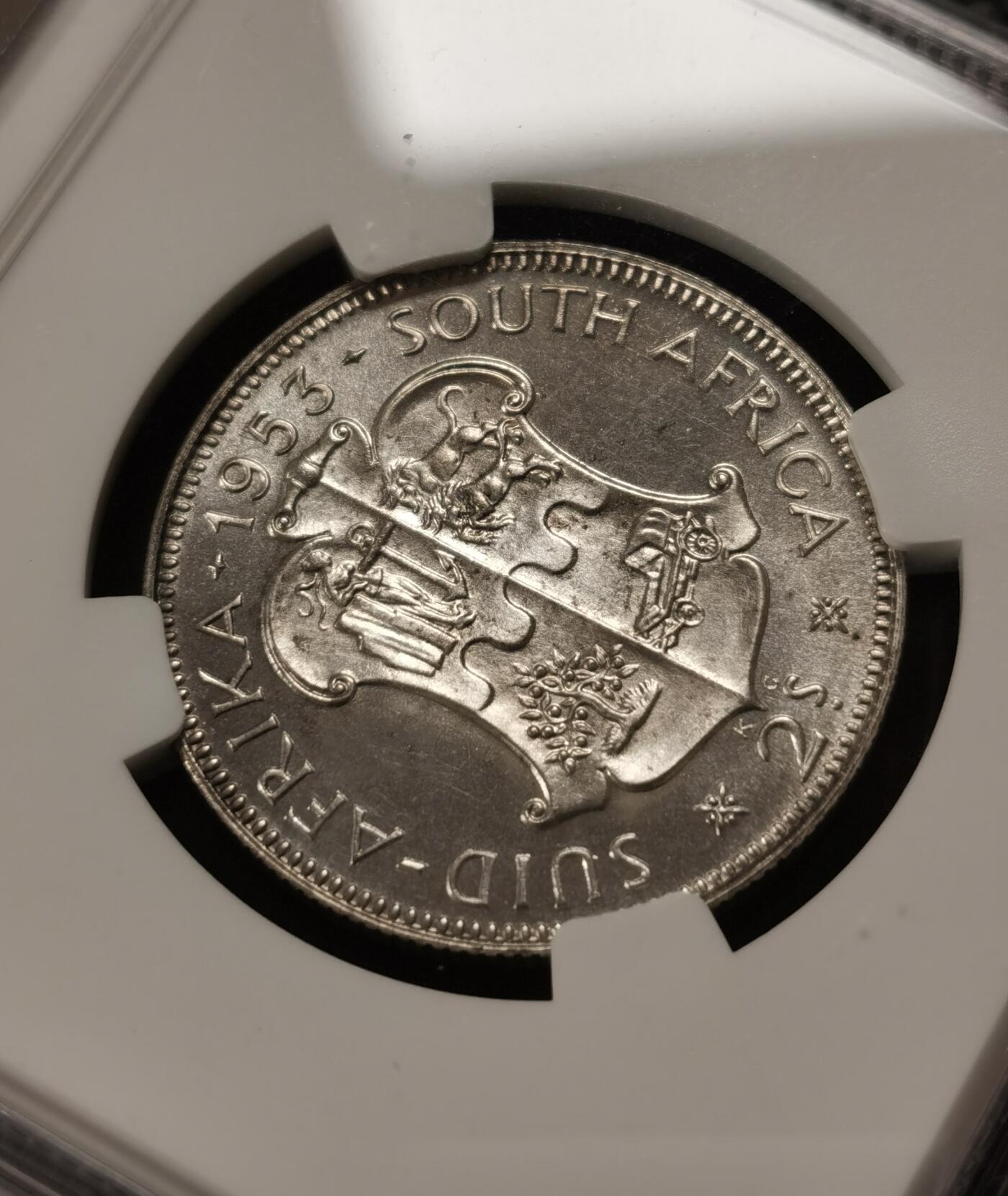 甄臻铺-世界钱币拍卖-南非西非东非专场（第10期）送拍享返佣金等优惠多多 NGC-PF66 英属南非 1953 2先令 银币精制 原味包浆，币面转光