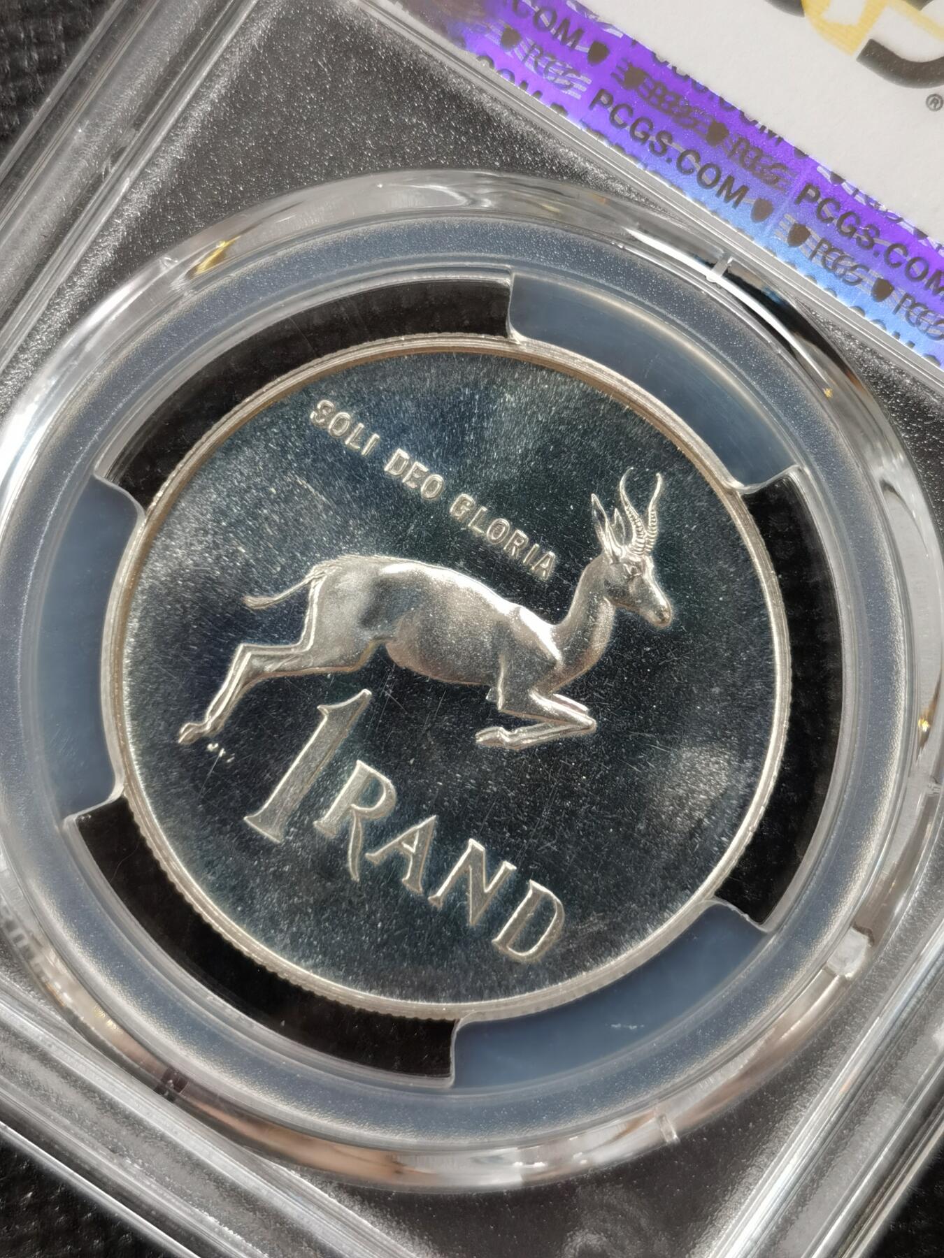 甄臻铺-世界钱币拍卖-南非西非东非专场（第10期）送拍享返佣金等优惠多多 PCGS-PR65 南非 1965 1兰特吕贝克精制银币，币面转光，收藏级