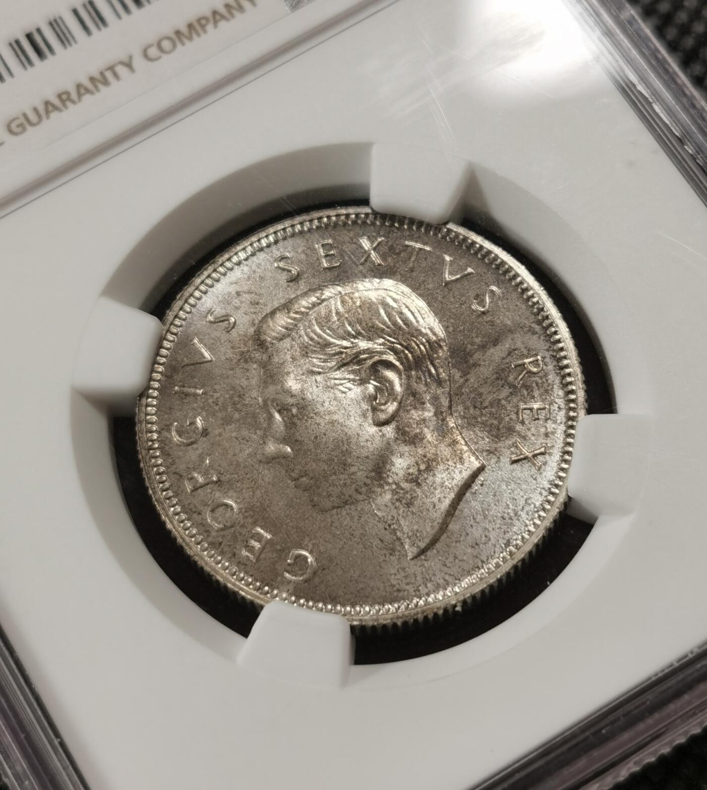 甄臻铺-世界钱币拍卖-南非西非东非专场（第10期）送拍享返佣金等优惠多多 NGC-PF66 英属南非 1952 2先令 银币精制 原味包浆，币面转光