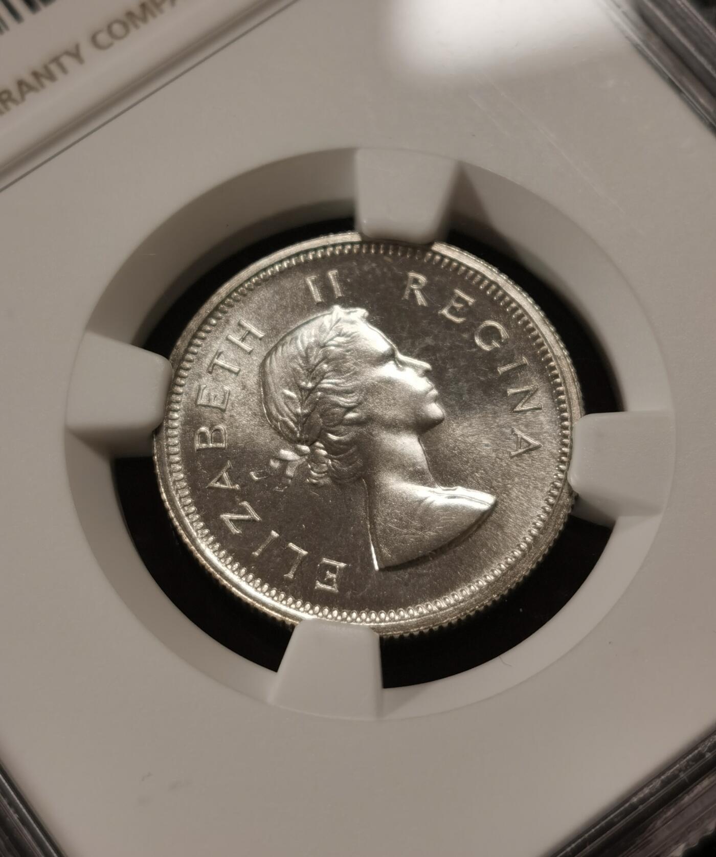 甄臻铺-世界钱币拍卖-南非西非东非专场（第10期）送拍享返佣金等优惠多多 NGC-PF65 英属南非 1953 1先令 银币精制 原味包浆，币面转光