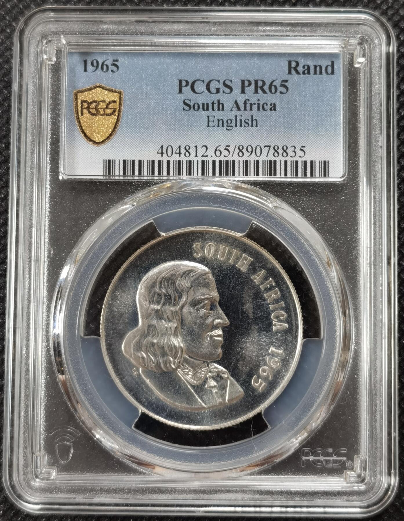 甄臻铺-世界钱币拍卖-南非西非东非专场（第10期）送拍享返佣金等优惠多多 PCGS-PR65 南非 1965 1兰特吕贝克精制银币，币面转光，收藏级