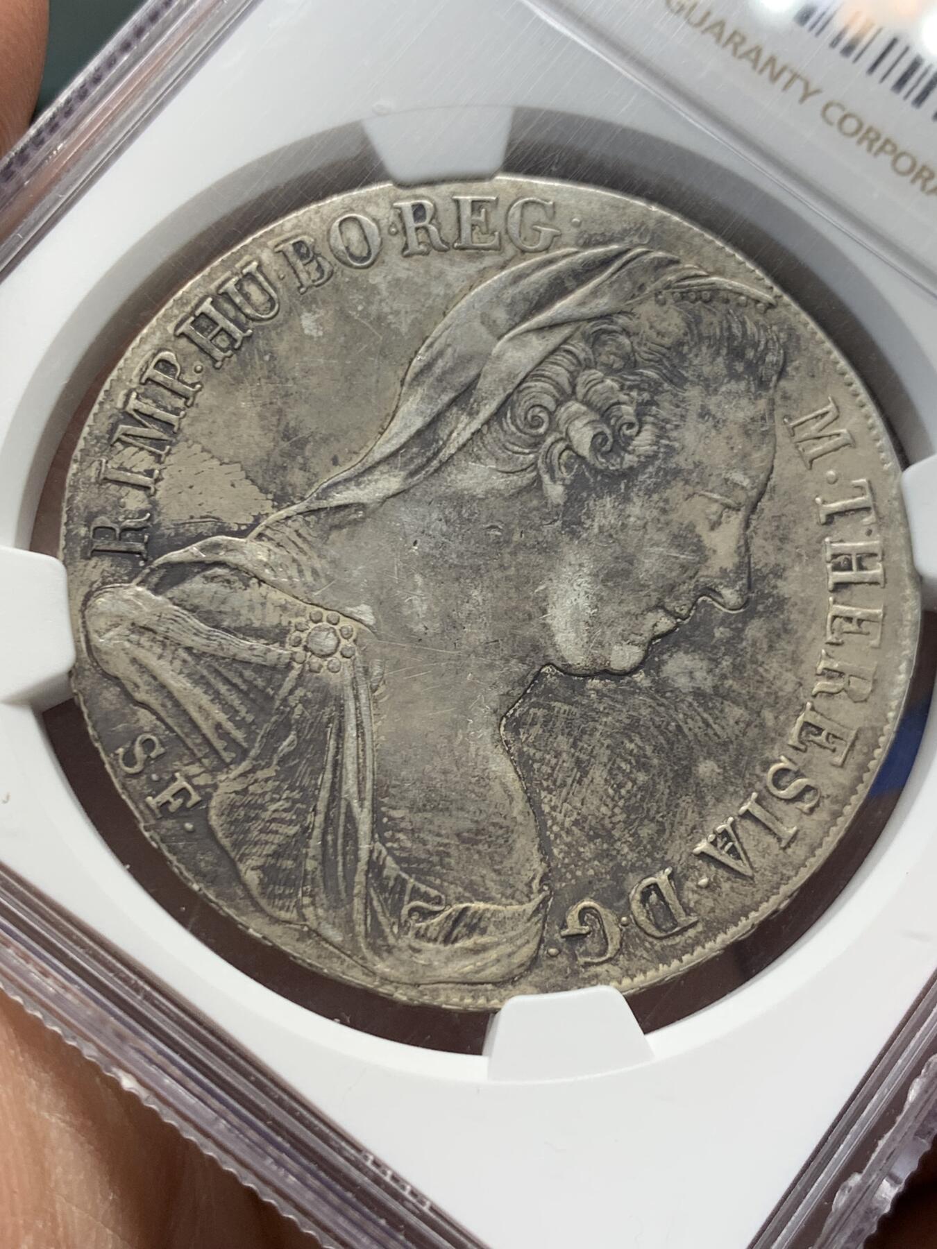 《竞宝斋》第366场 周日，周一 2场连拍 （全场包邮） NGC XF 奥匈帝国  1815-1828年米兰版玛丽亚·特蕾莎贸易银币。面：玛丽亚·特蕾莎女皇披纱半身像。背：双头鹰徽记。面值：1泰勒。目录编号：Hafner 36a，包浆币。