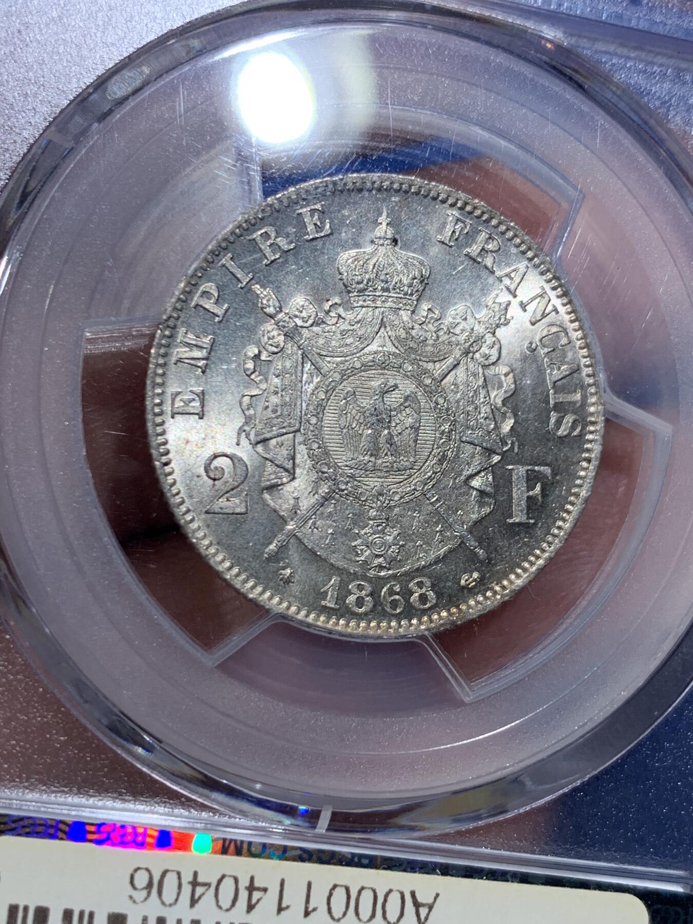 《竞宝斋》第367场 周日，周一 2场连拍 （全场包邮） PCGS MS62 法国1868年A版拿破仑三世2法郎银币，少见面值，流通充分，高分比5法郎少见很多。此枚银光丝滑如水，强烈转光，鹰毛纤毫毕现，状态好于分数！