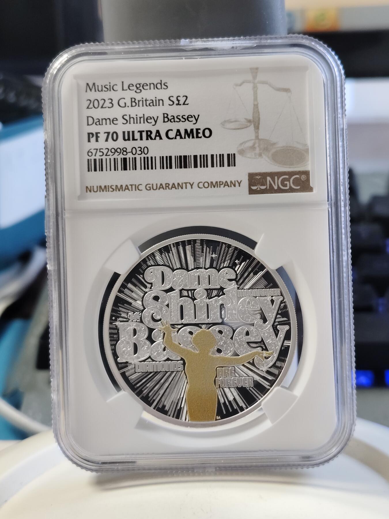 第168期拍卖【长期征集拍品】 英国2023年音乐传奇系列雪莉贝西2英镑彩色精制纪念银币NGC-PF70原盒证书，999银，1盎司，发行2500枚
