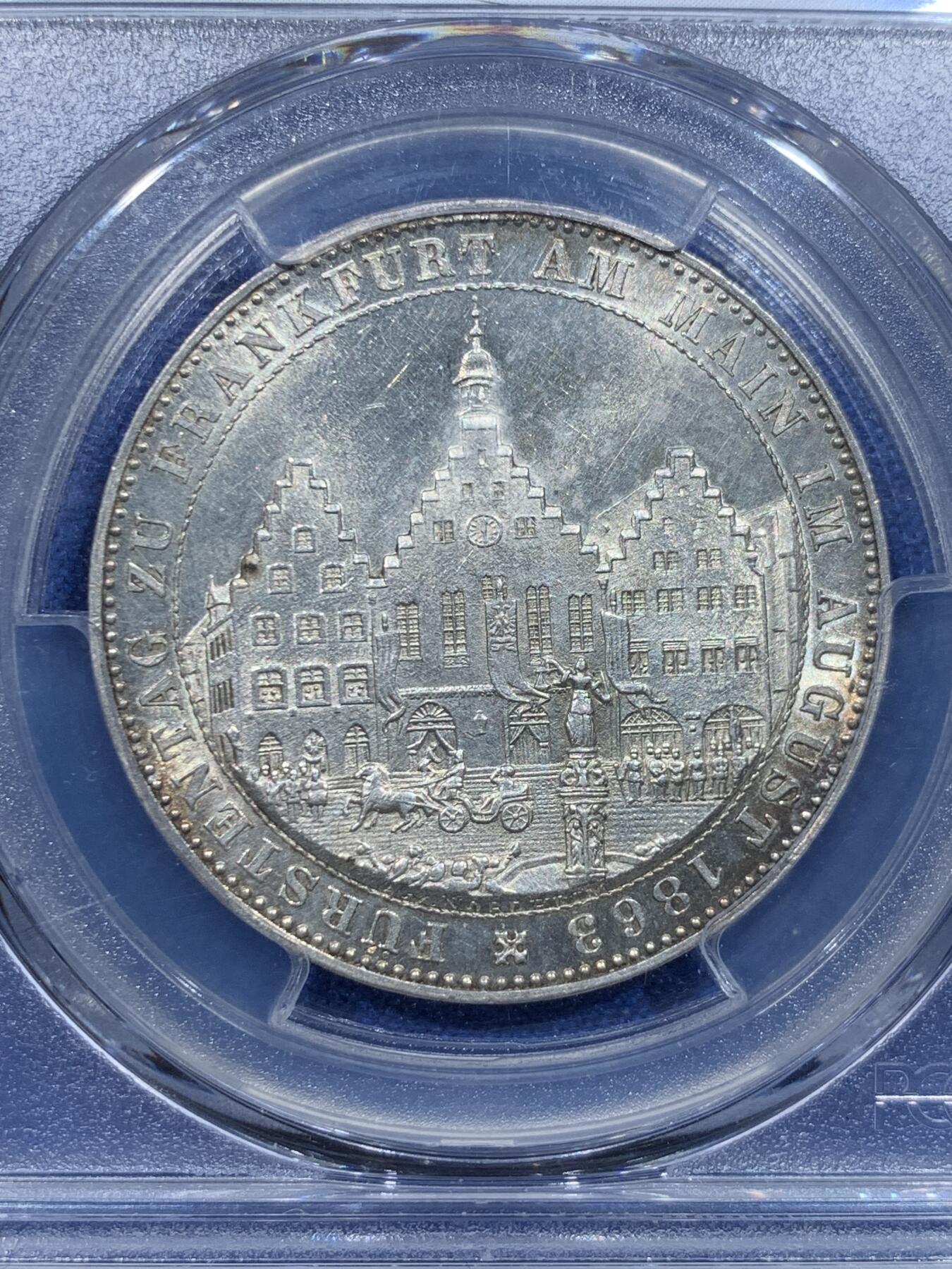 《竞宝斋》第370场 周日，周一 2场连拍 （全场包邮） PCGS MS64 德国1863年法兰克福王子议会泰勒银币，底板状态漂亮，经典的法兰克福市政厅。