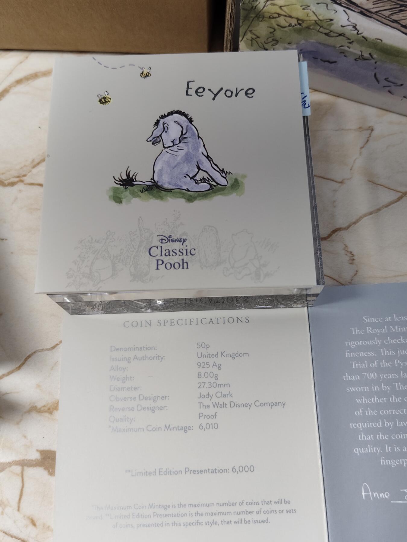第168期拍卖【长期征集拍品】 英国2022年小熊维尼熊系列小熊屹耳精制彩色纪念银币NGC-PF69原盒证书，925银，8克，发行6000枚