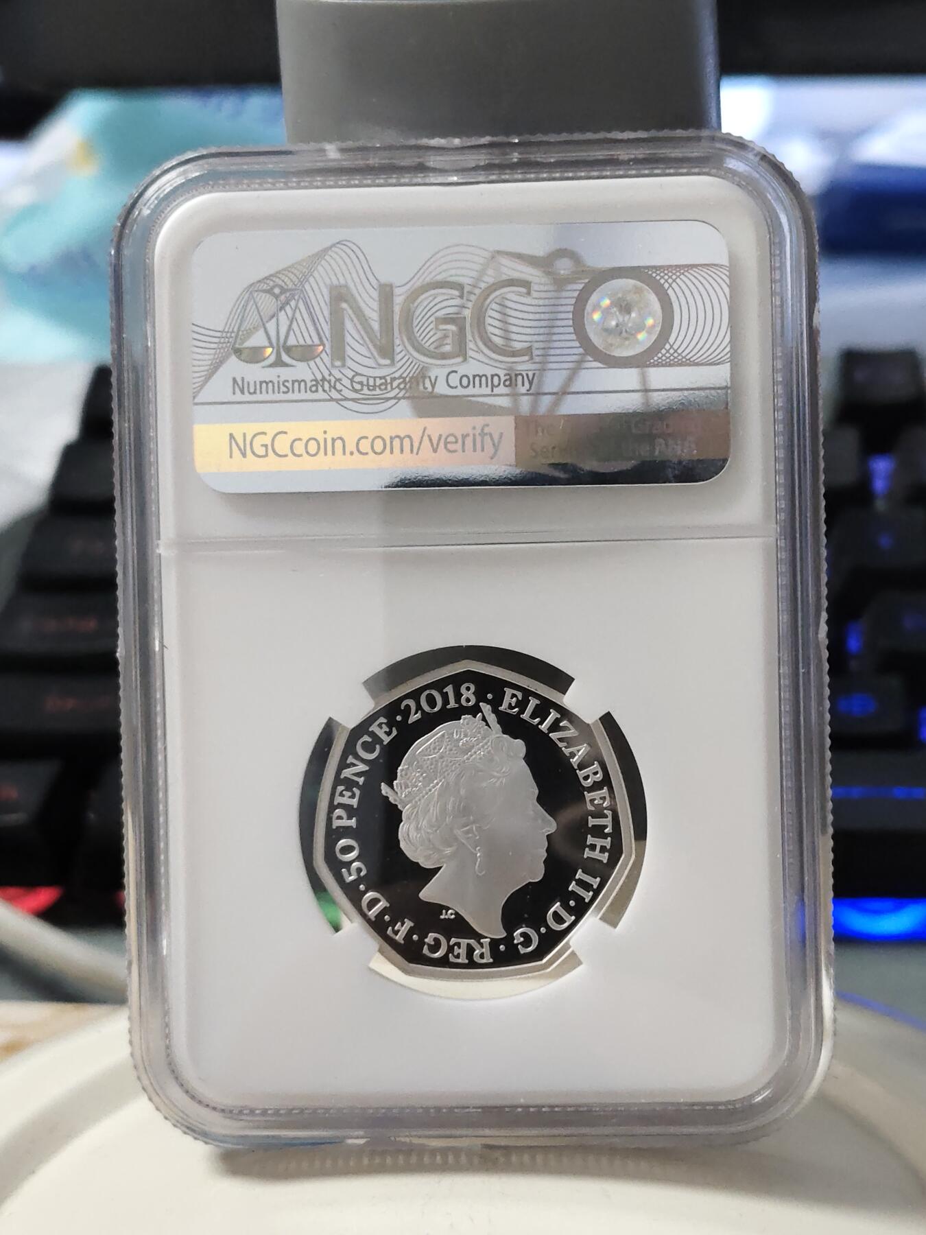 第168期拍卖【长期征集拍品】 英国2018年彼得兔系列彼得兔50便士彩色银币NGC-PF69原盒证书，925银，8克，发行35000枚