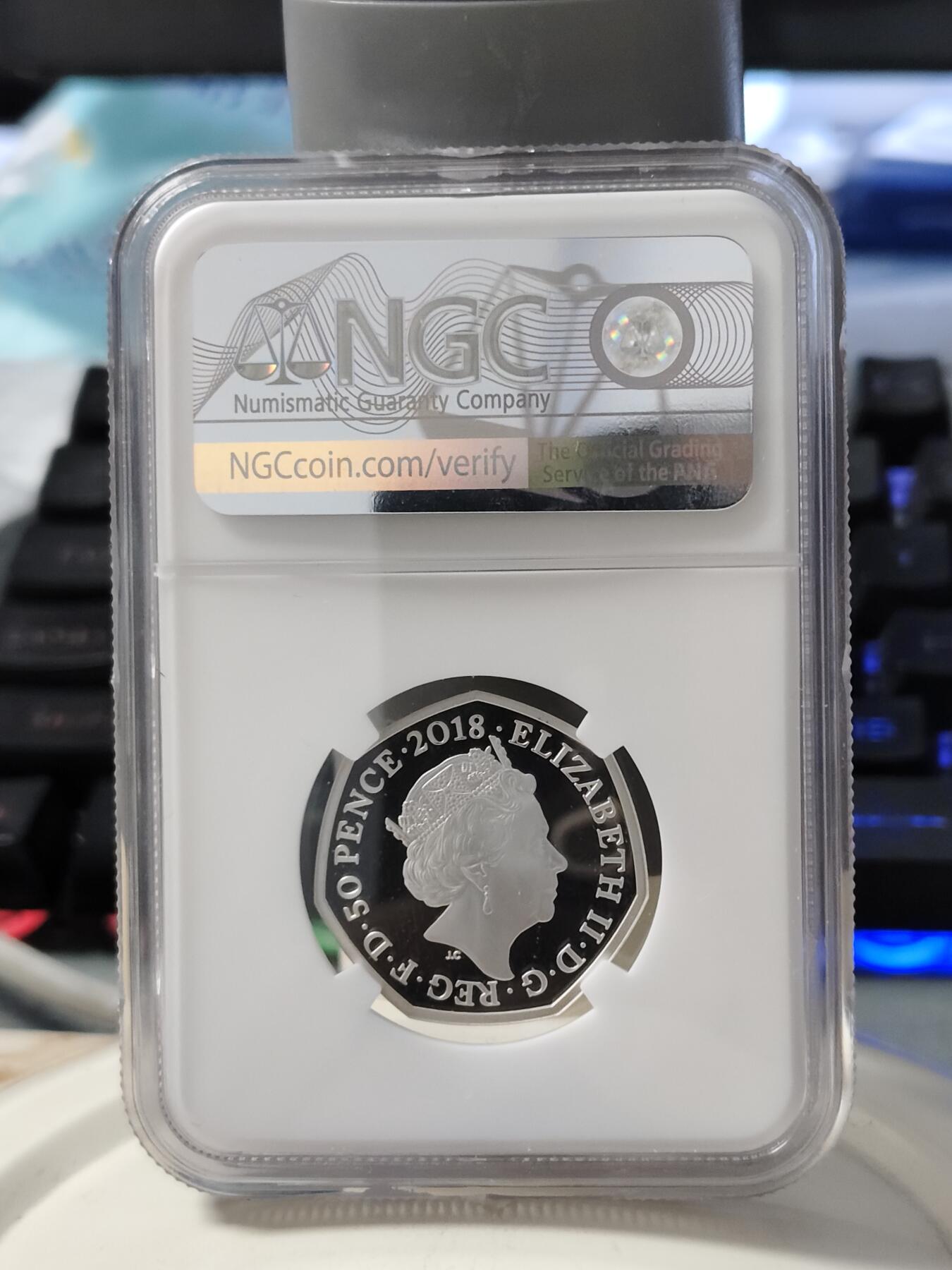 第168期拍卖【长期征集拍品】 英国2018年彼得兔系列彼得兔50便士彩色银币NGC-PF69原盒证书，925银，8克，发行35000枚