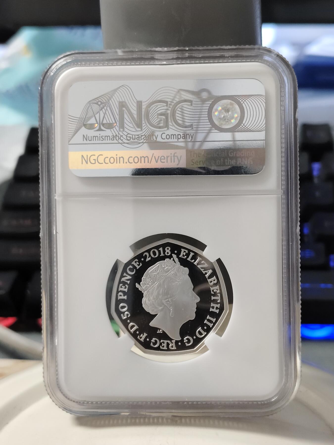 第168期拍卖【长期征集拍品】 英国2018年彼得兔系列彼得兔50便士彩色银币NGC-PF69原盒证书，925银，8克，发行35000枚