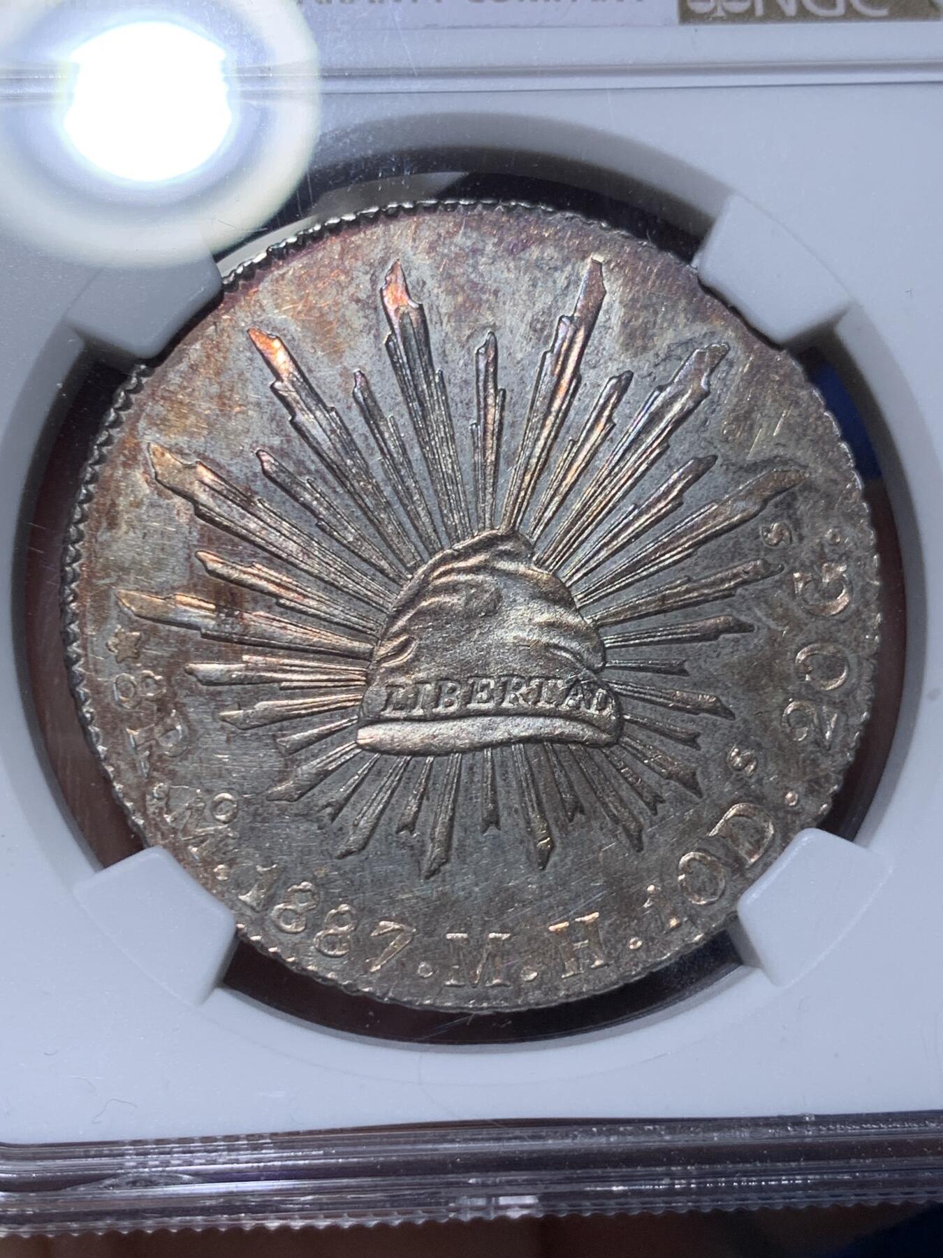 《竞宝斋》第372场 周日，周一 2场连拍 （全场包邮） NGC MS63 墨西哥 1887年 8瑞尔 花边鹰洋 银币 底板PL感很好 搭配上紫色包浆 相得益彰
