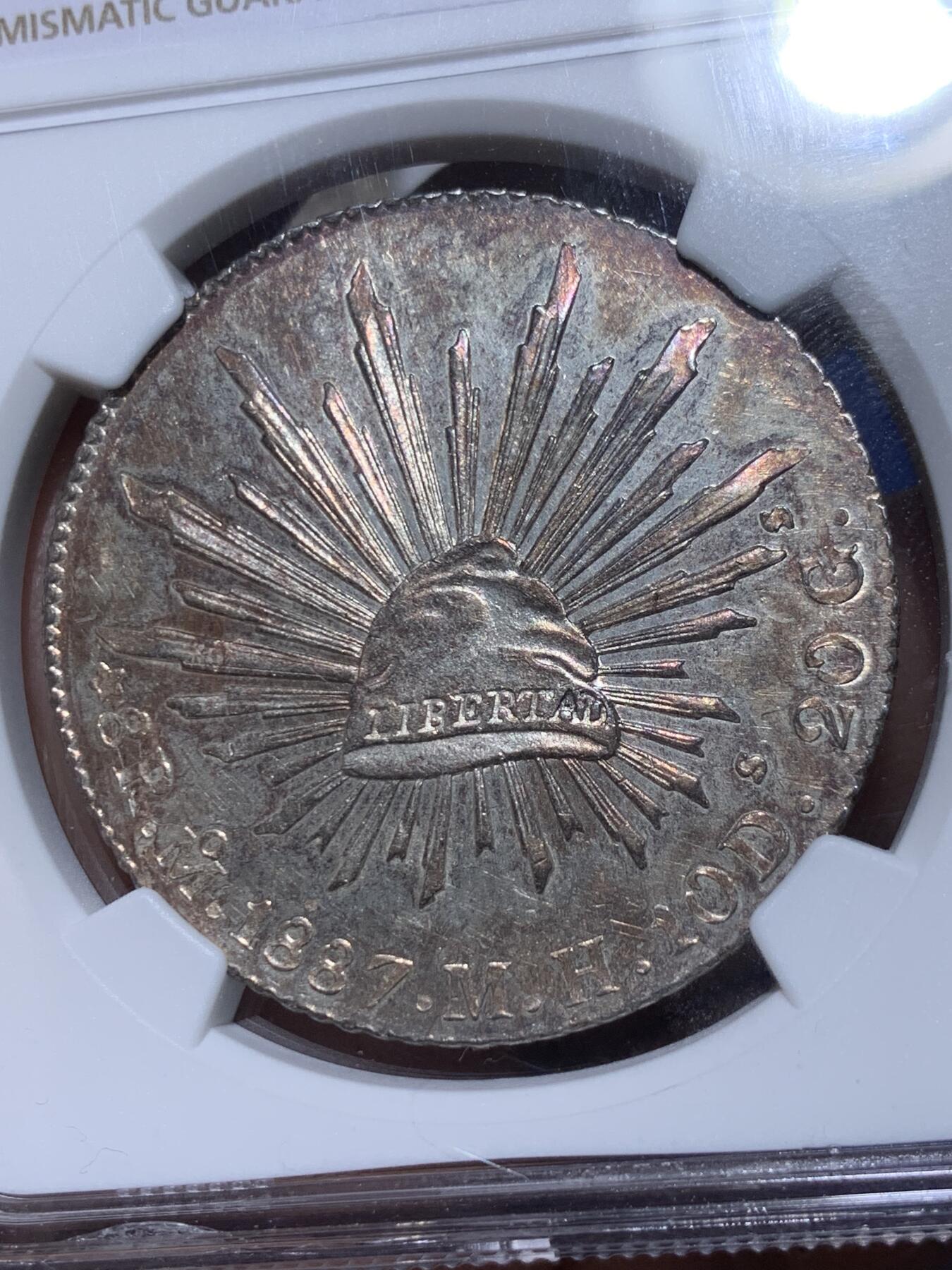 《竞宝斋》第372场 周日，周一 2场连拍 （全场包邮） NGC MS63 墨西哥 1887年 8瑞尔 花边鹰洋 银币 底板PL感很好 搭配上紫色包浆 相得益彰